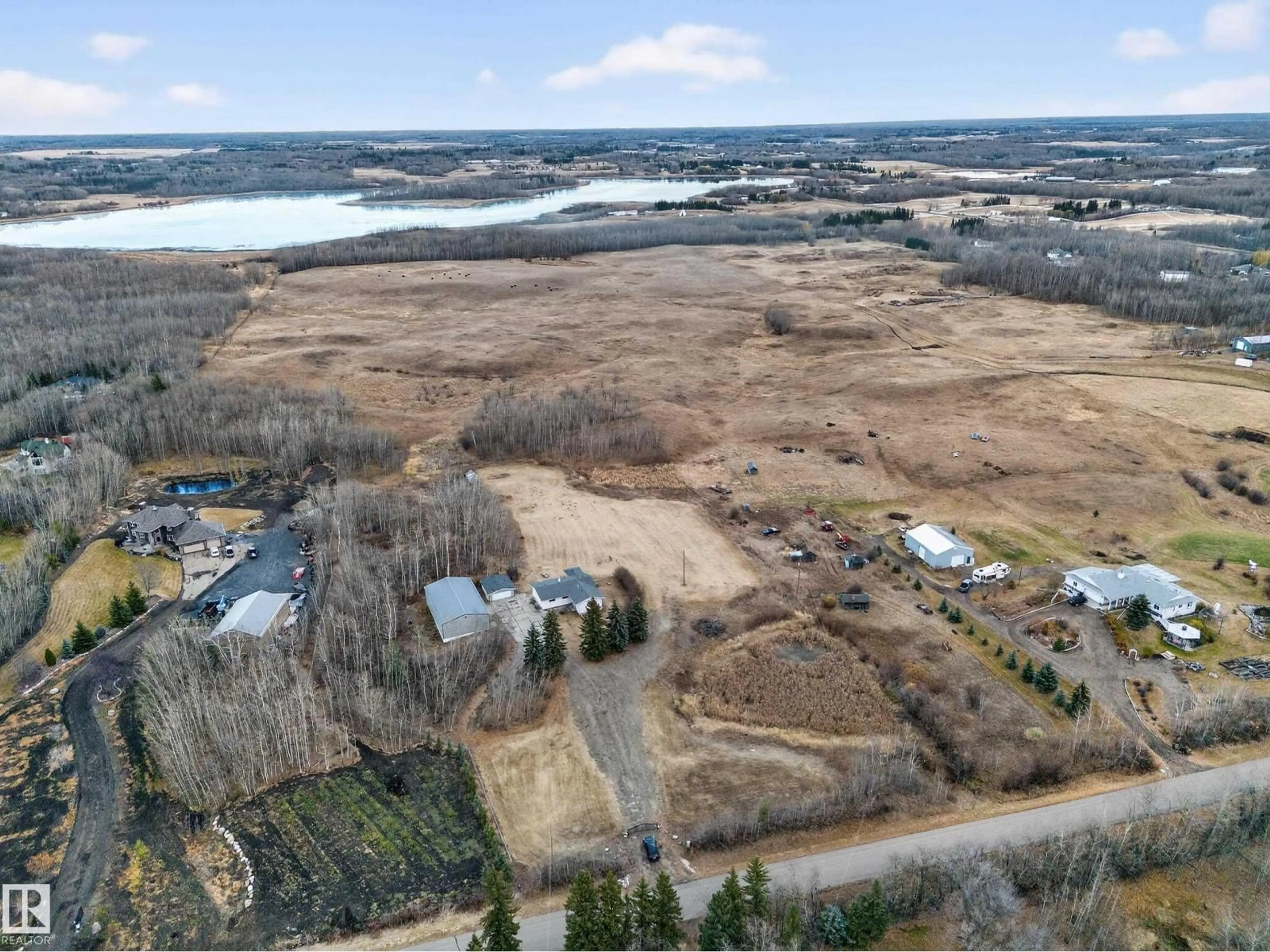 A pic from outside/outdoor area/front of a property/back of a property/a pic from drone, water/lake/river/ocean view for 52235 RANGE ROAD 225, Rural Strathcona County Alberta T8C1C7
