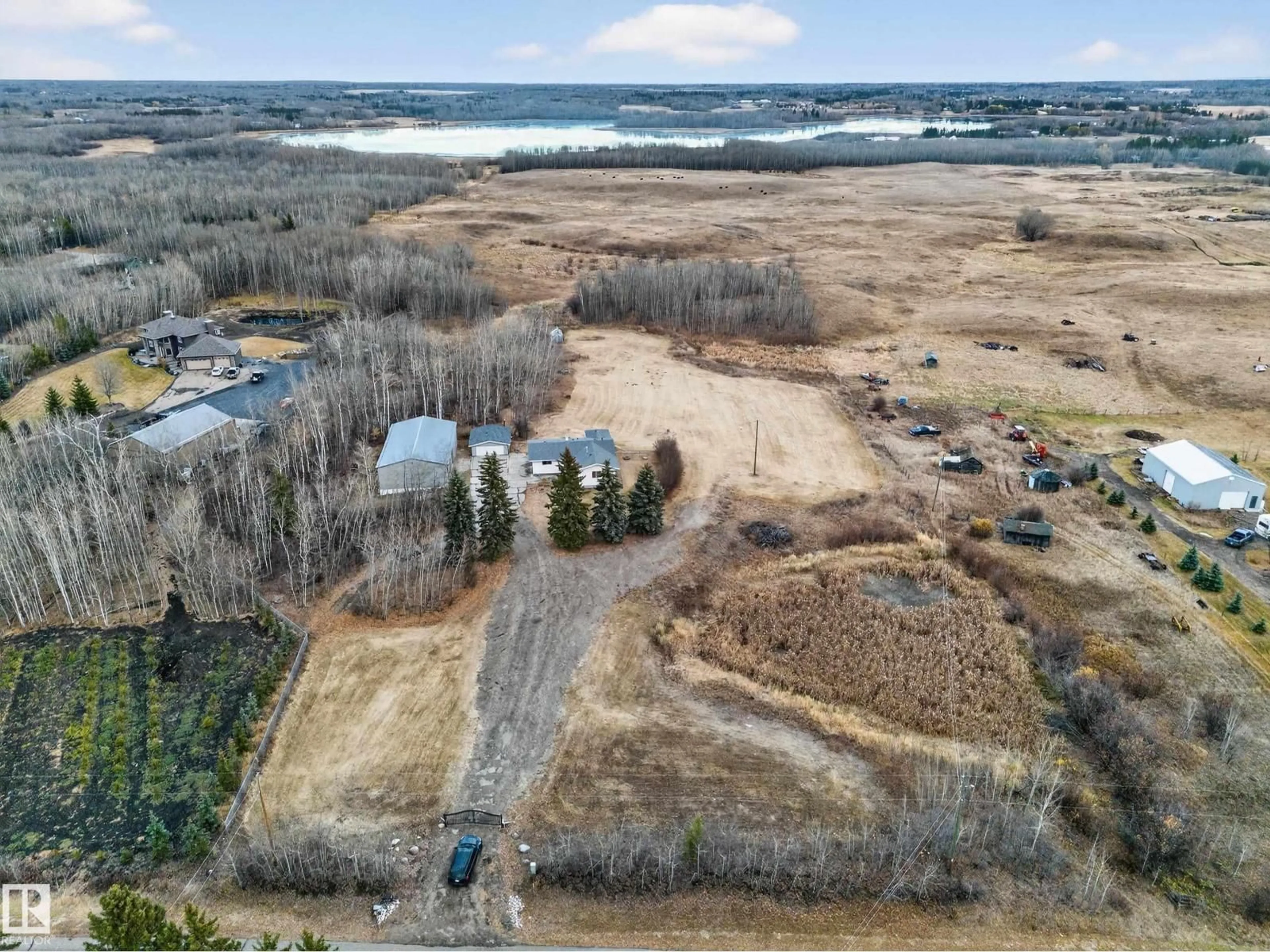 A pic from outside/outdoor area/front of a property/back of a property/a pic from drone, water/lake/river/ocean view for 52235 RANGE ROAD 225, Rural Strathcona County Alberta T8C1C7