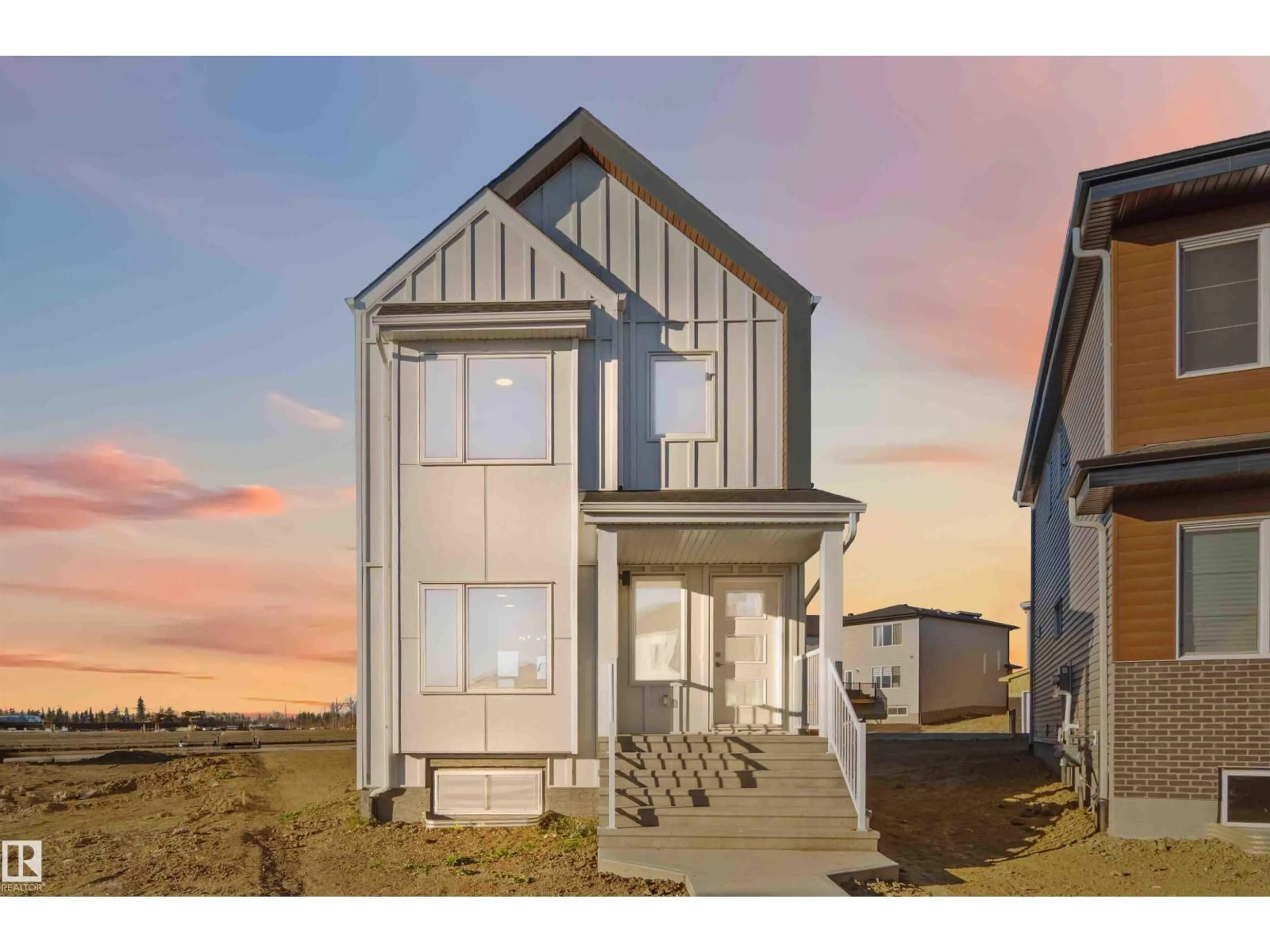 Home with vinyl exterior material, street for NE - 17306 6A ST, Edmonton Alberta T5Y4J7