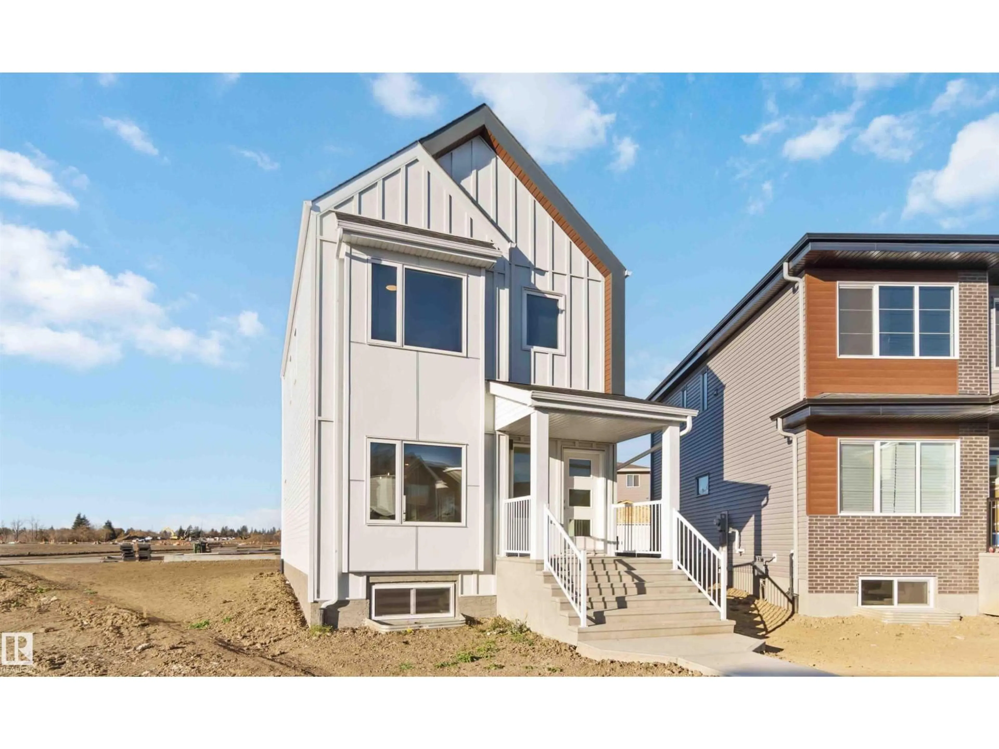 Home with vinyl exterior material, street for NE - 17306 6A ST, Edmonton Alberta T5Y4J7