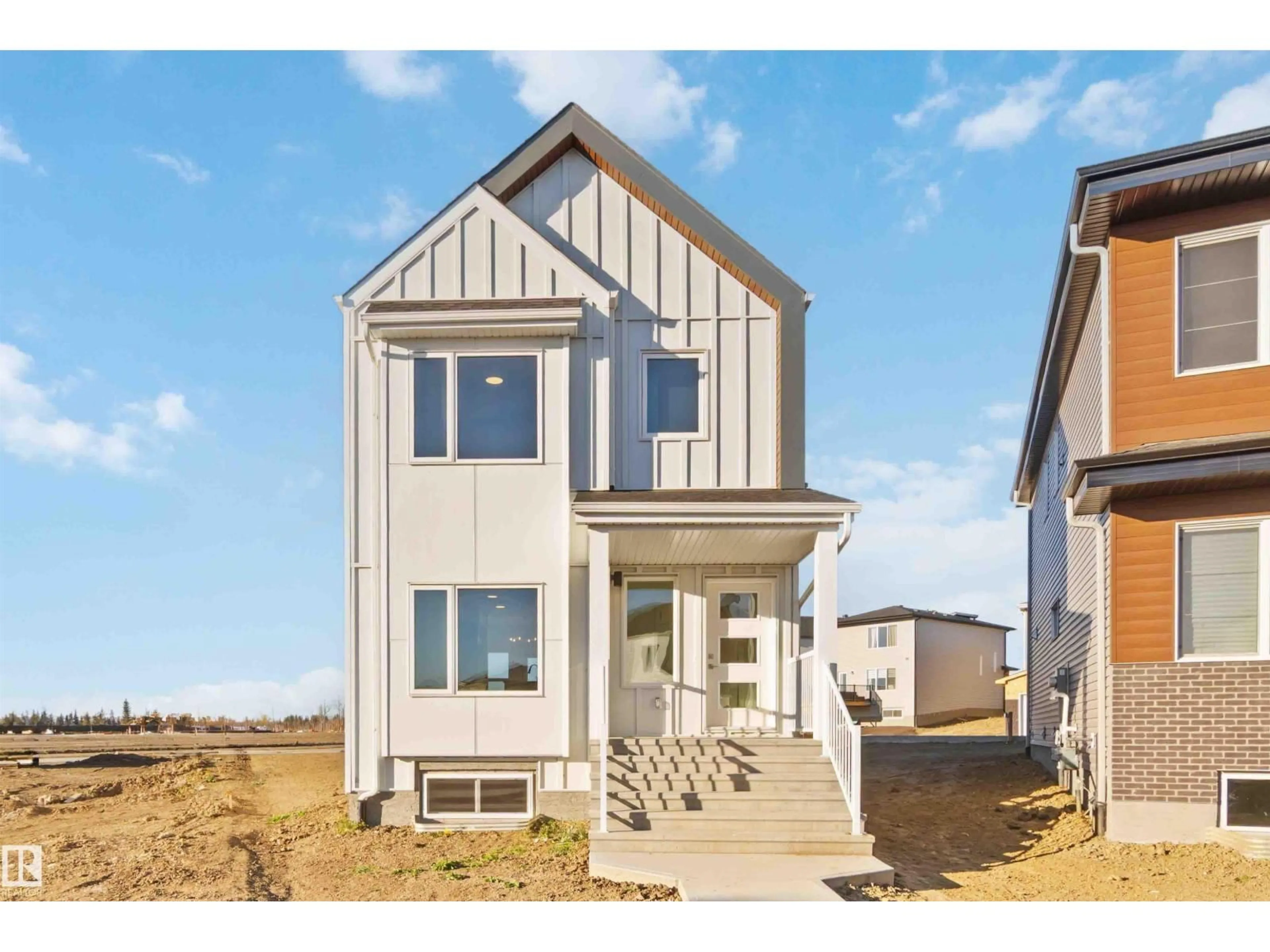 Home with vinyl exterior material, street for NE - 17306 6A ST, Edmonton Alberta T5Y4J7