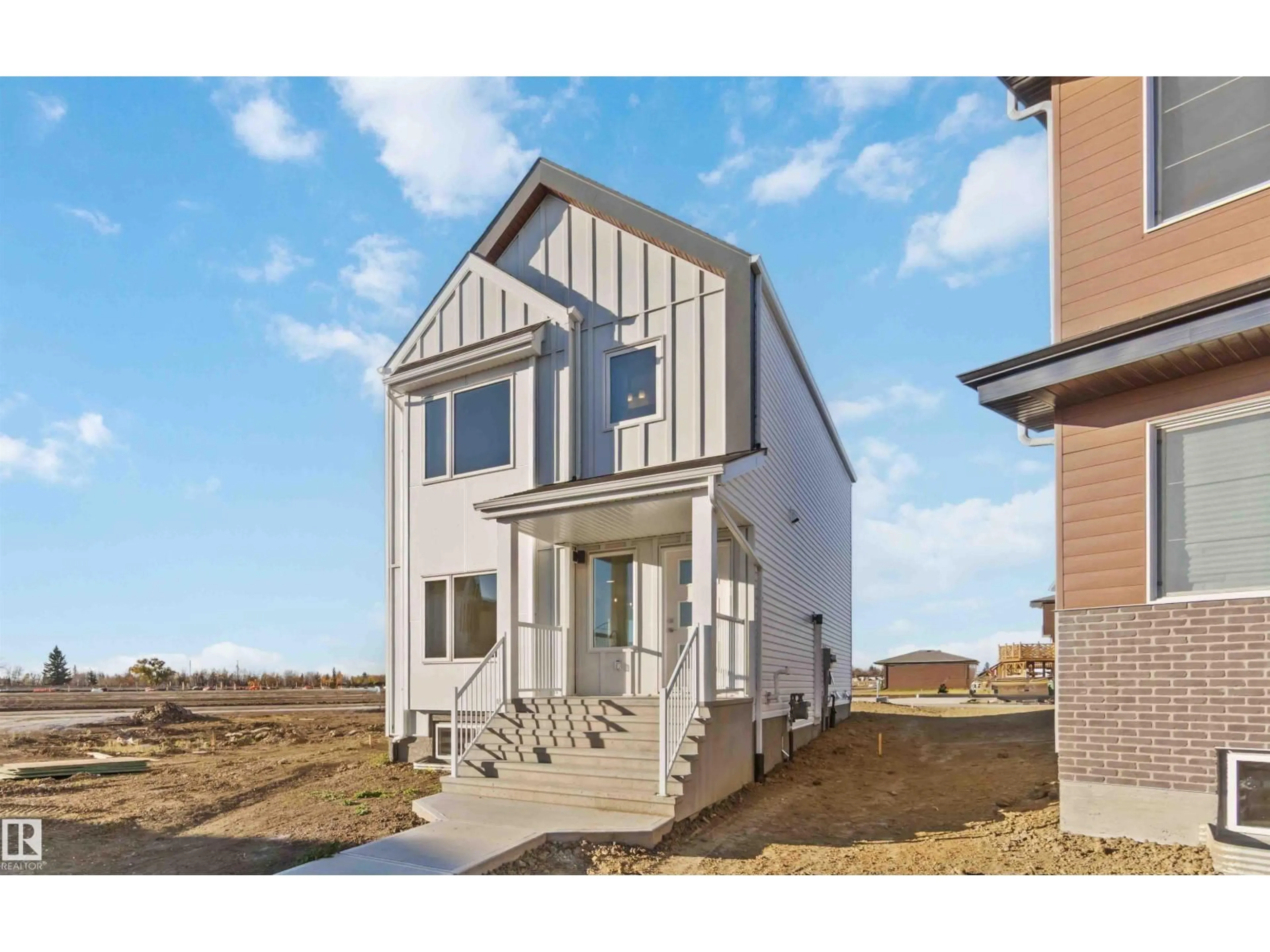 Home with vinyl exterior material, street for NE - 17306 6A ST, Edmonton Alberta T5Y4J7