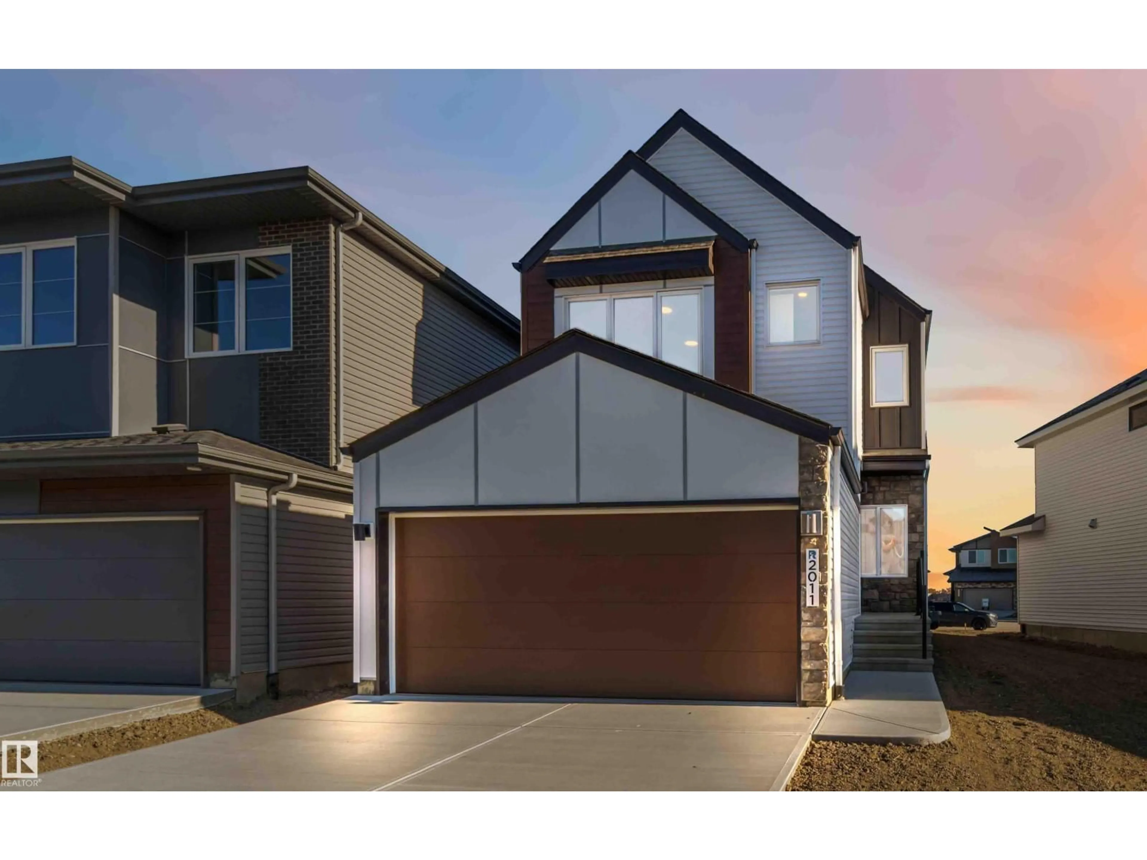 Home with vinyl exterior material, street for NW - 2011 191 ST, Edmonton Alberta T6M3E8