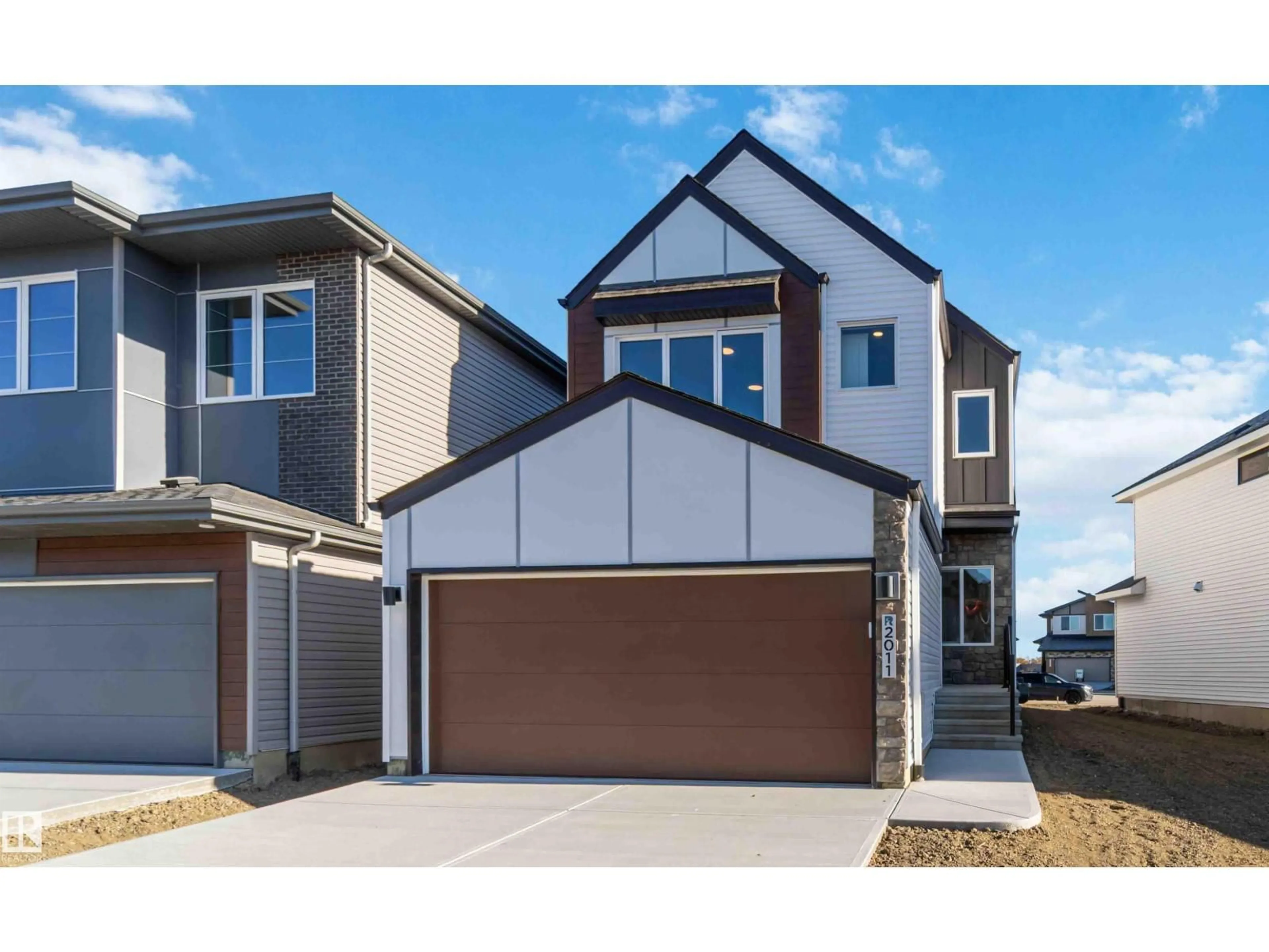 Home with vinyl exterior material, street for NW - 2011 191 ST, Edmonton Alberta T6M3E8