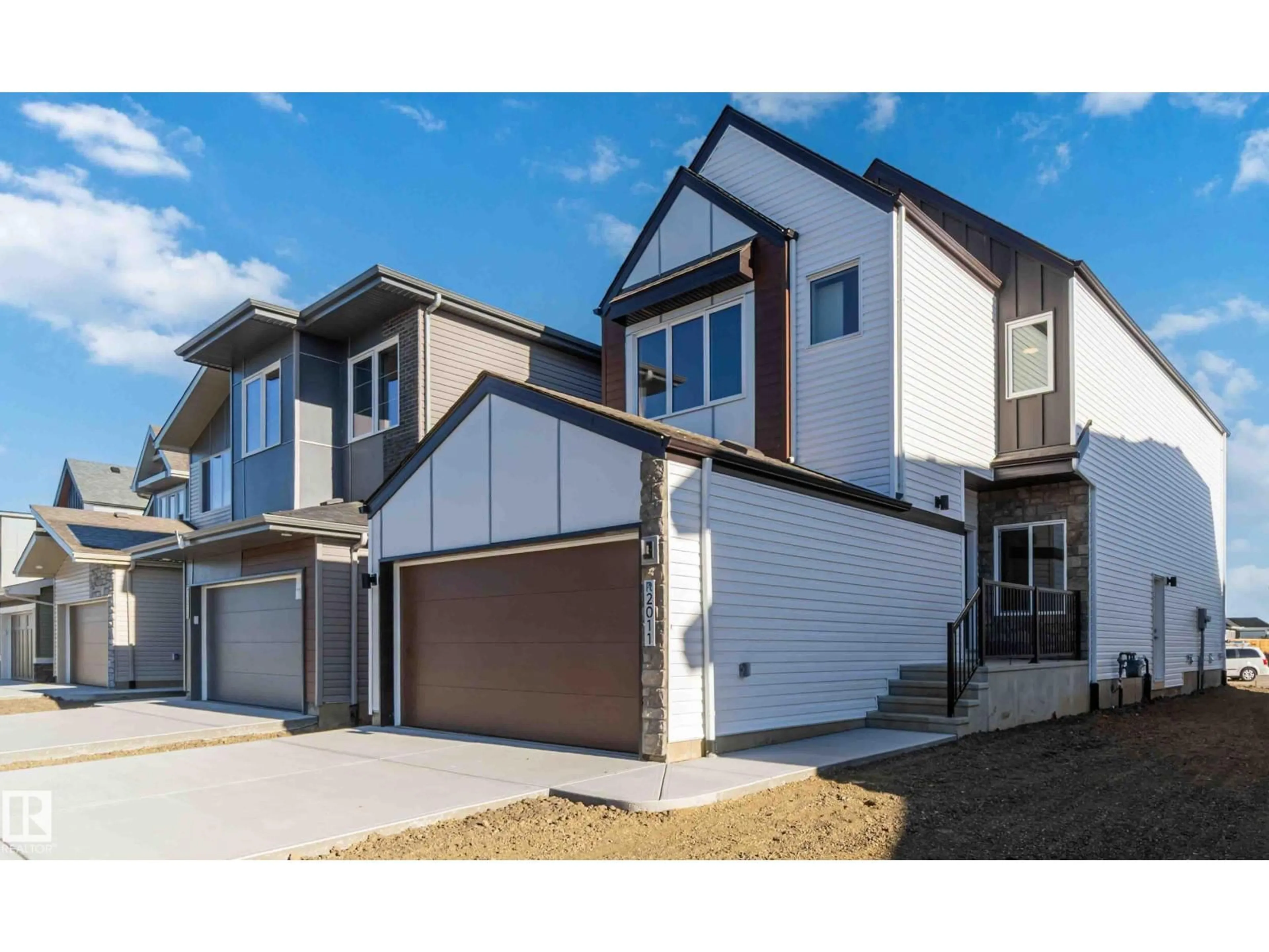 Home with vinyl exterior material, street for NW - 2011 191 ST, Edmonton Alberta T6M3E8