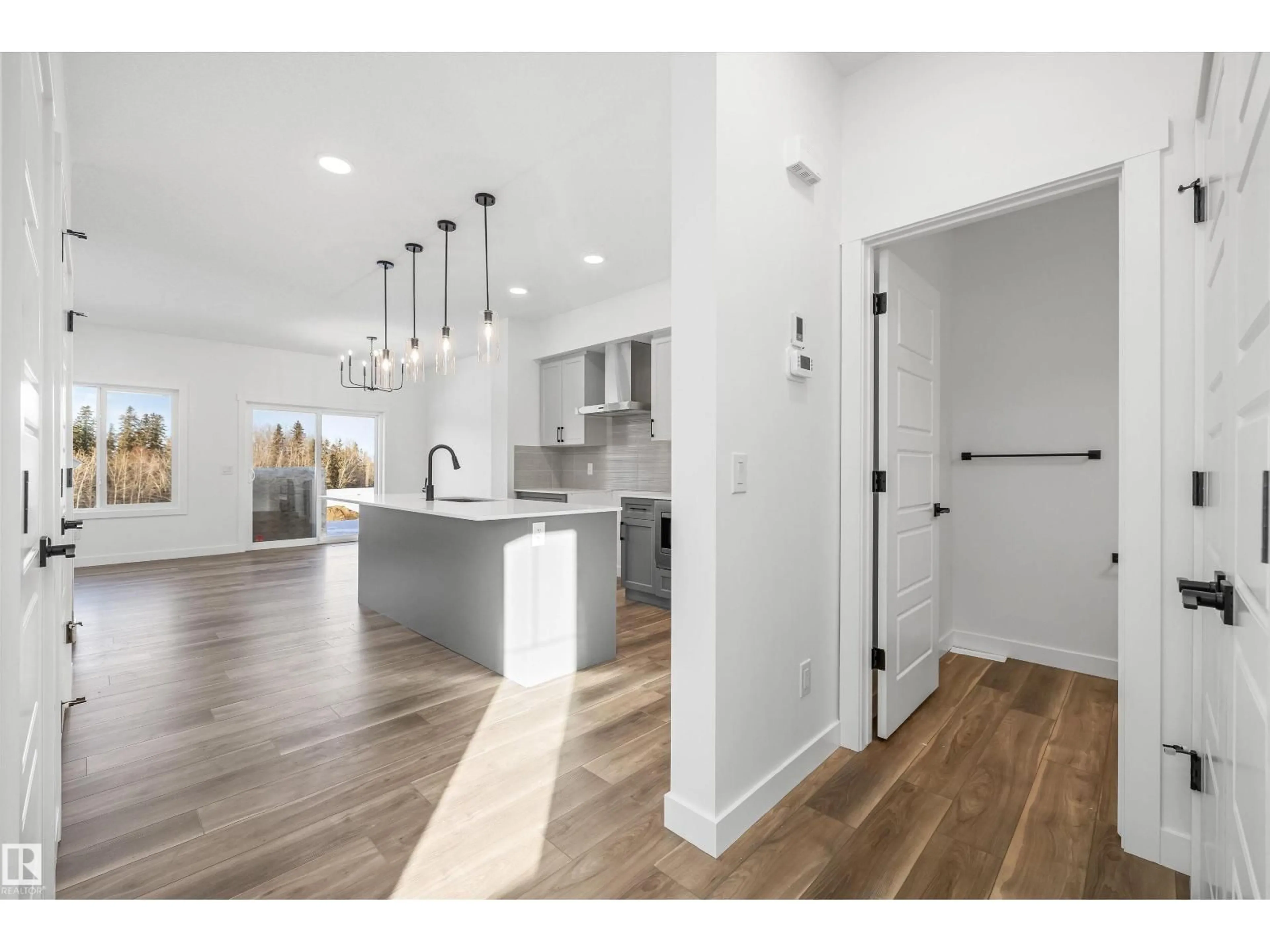 Open concept kitchen, wood/laminate floor for 4180 KINGLET DR, Edmonton Alberta T5S0W9