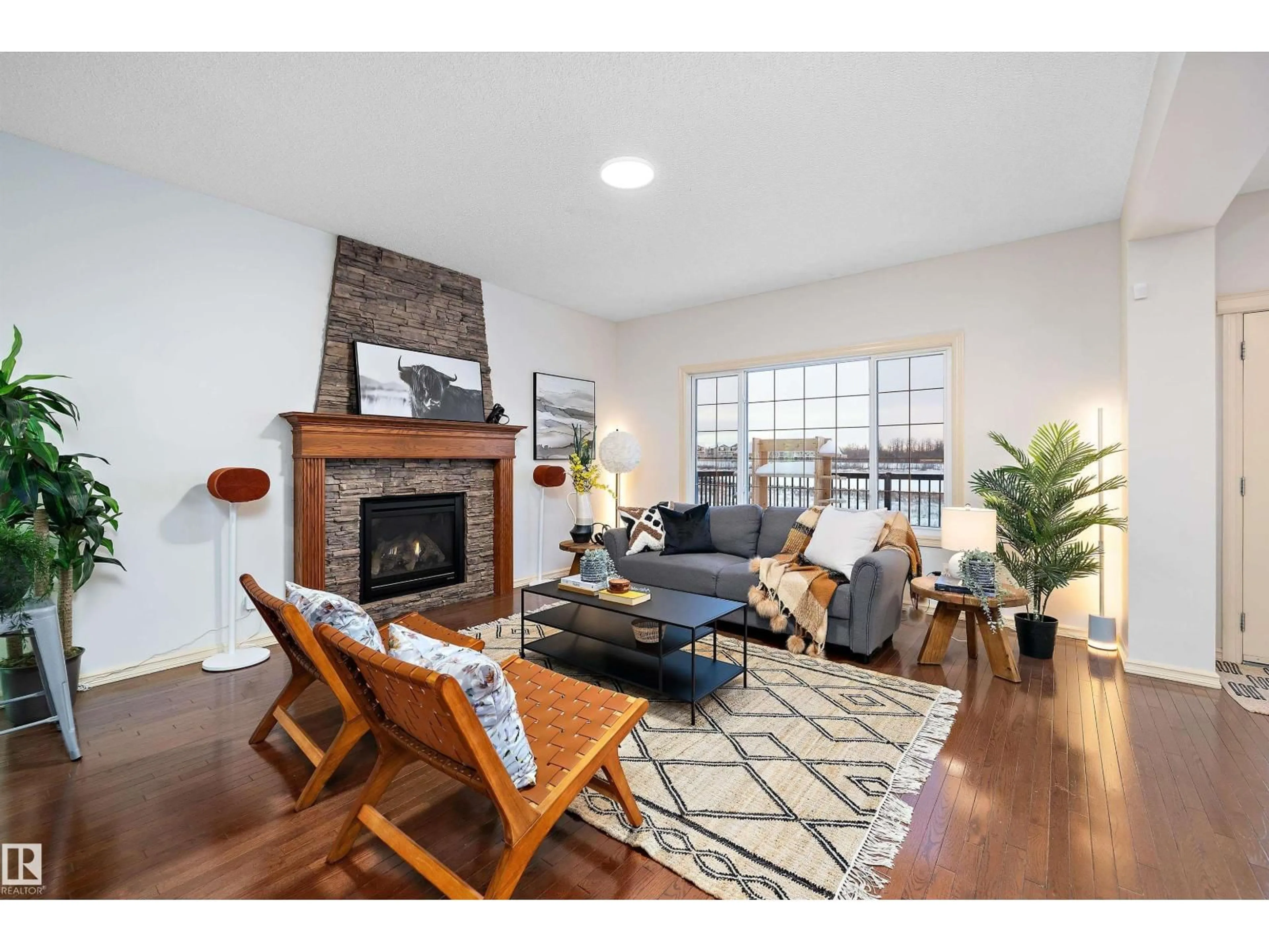 Living room with furniture, wood/laminate floor for NW - 17831 84 ST, Edmonton Alberta T5Z0C3