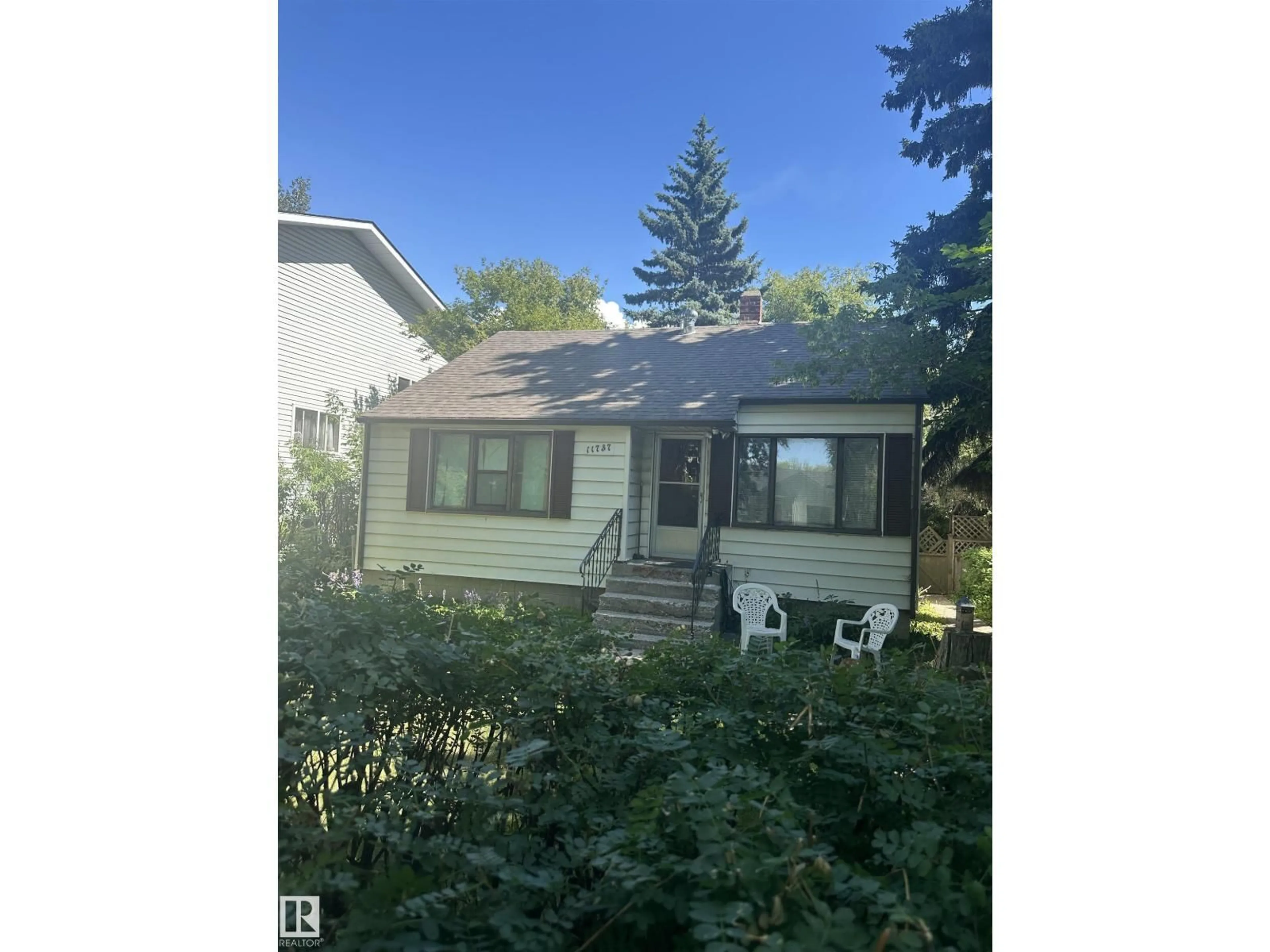 Home with vinyl exterior material, street for NW - 11737 125 ST, Edmonton Alberta T5M0N7