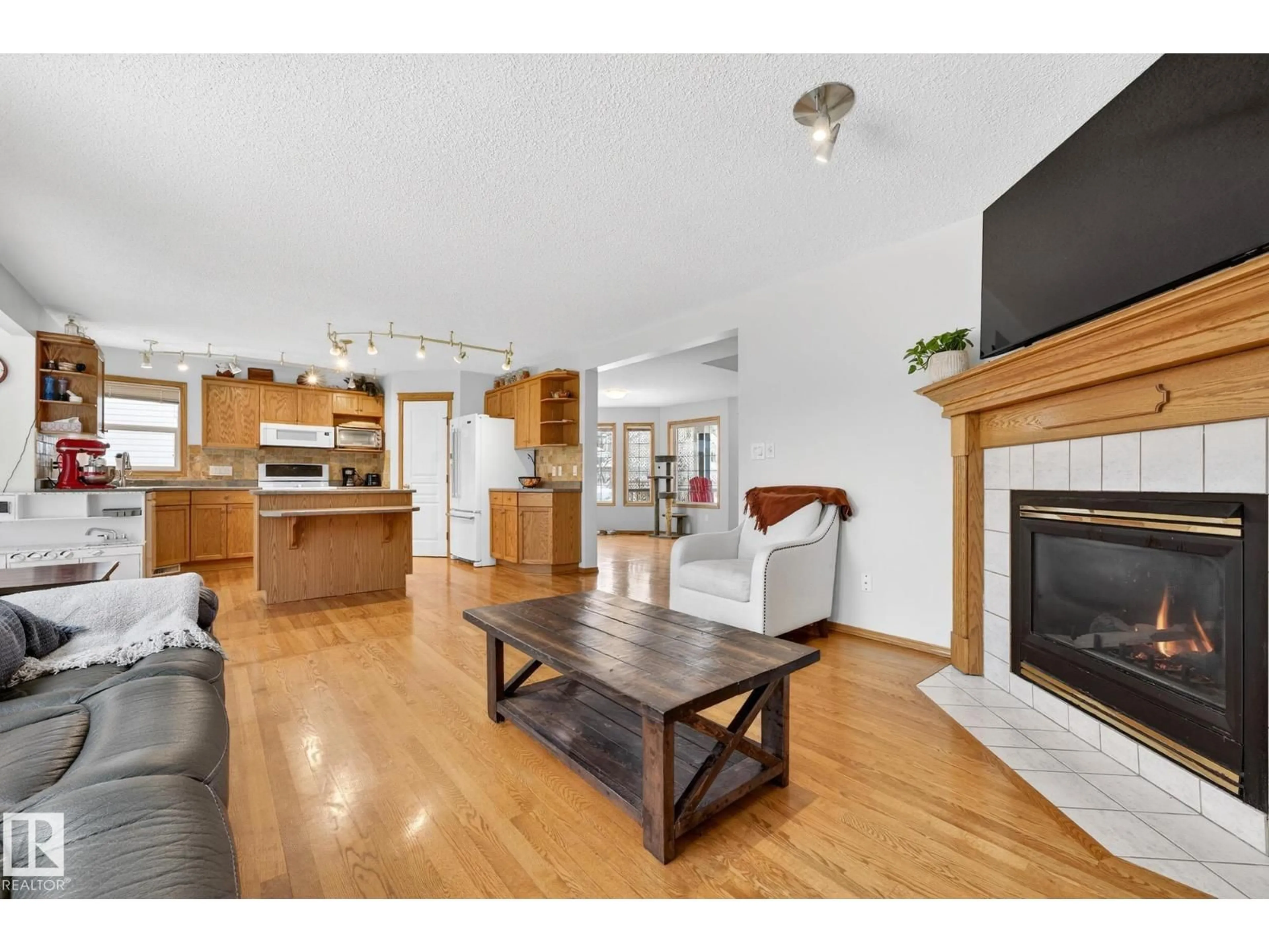 Open concept kitchen, wood/laminate floor for NW - 4027 31 ST, Edmonton Alberta T6T1L3