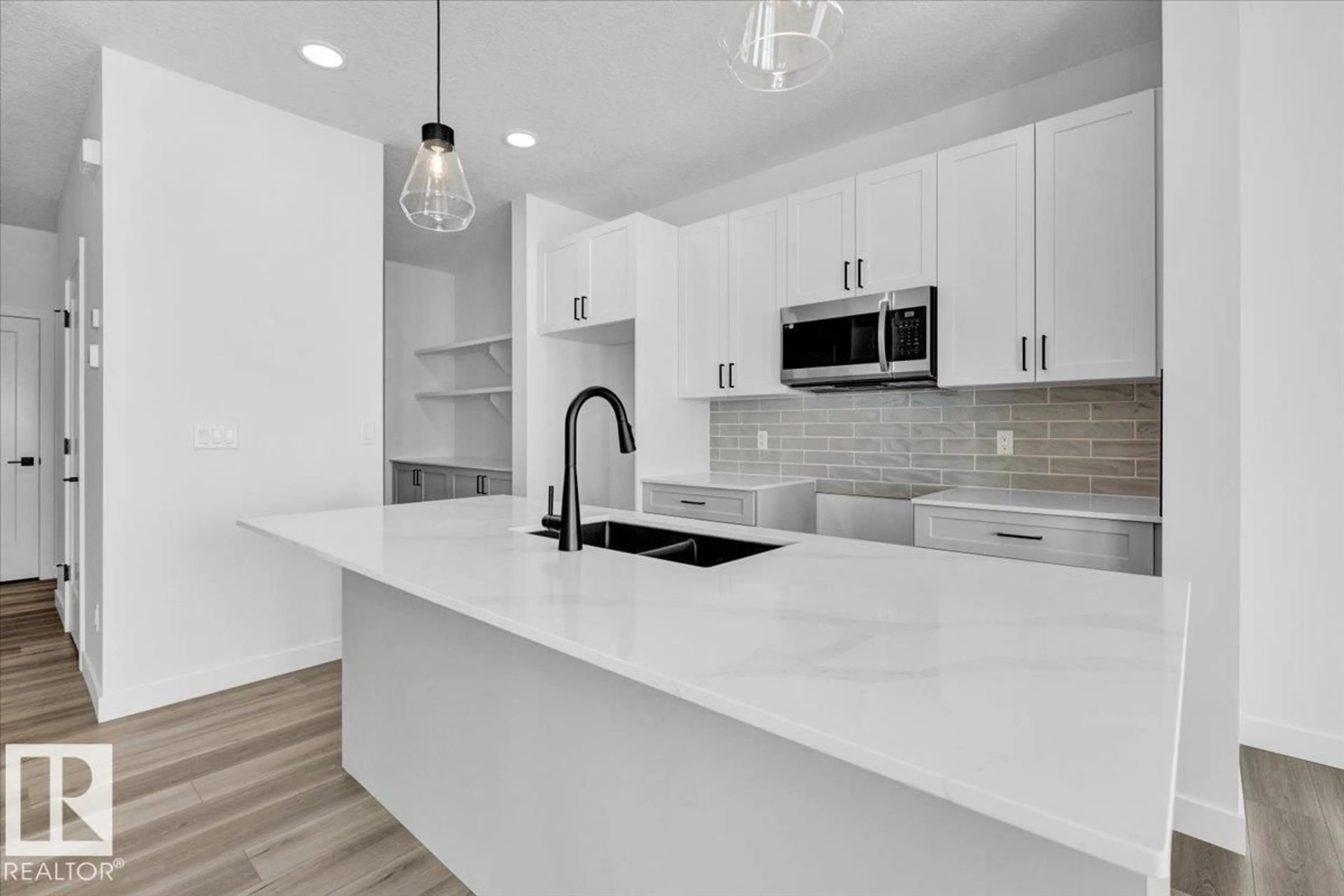 Open concept kitchen, ceramic/tile floor for 22 FICUS WY, Fort Saskatchewan Alberta T8L0Z6