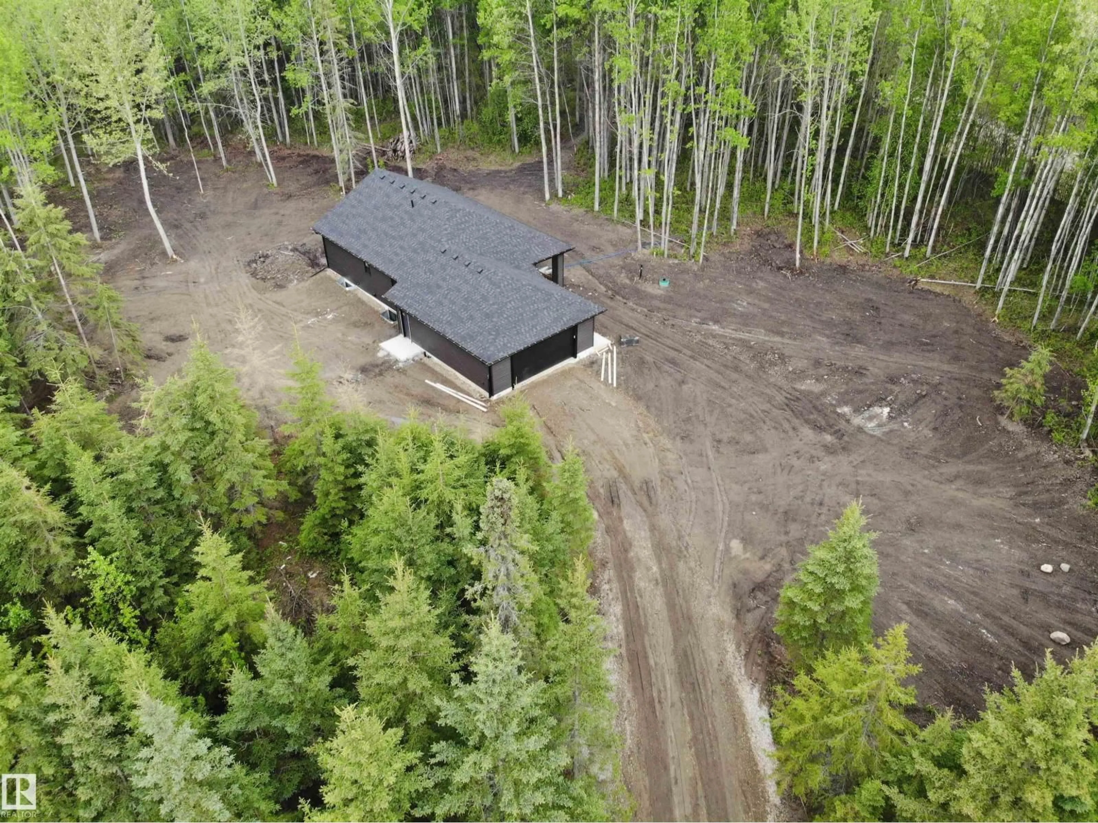 A pic from outside/outdoor area/front of a property/back of a property/a pic from drone, forest/trees view for 37 - 420 1414 HWY, Rural Lac Ste. Anne County Alberta T5A1H3