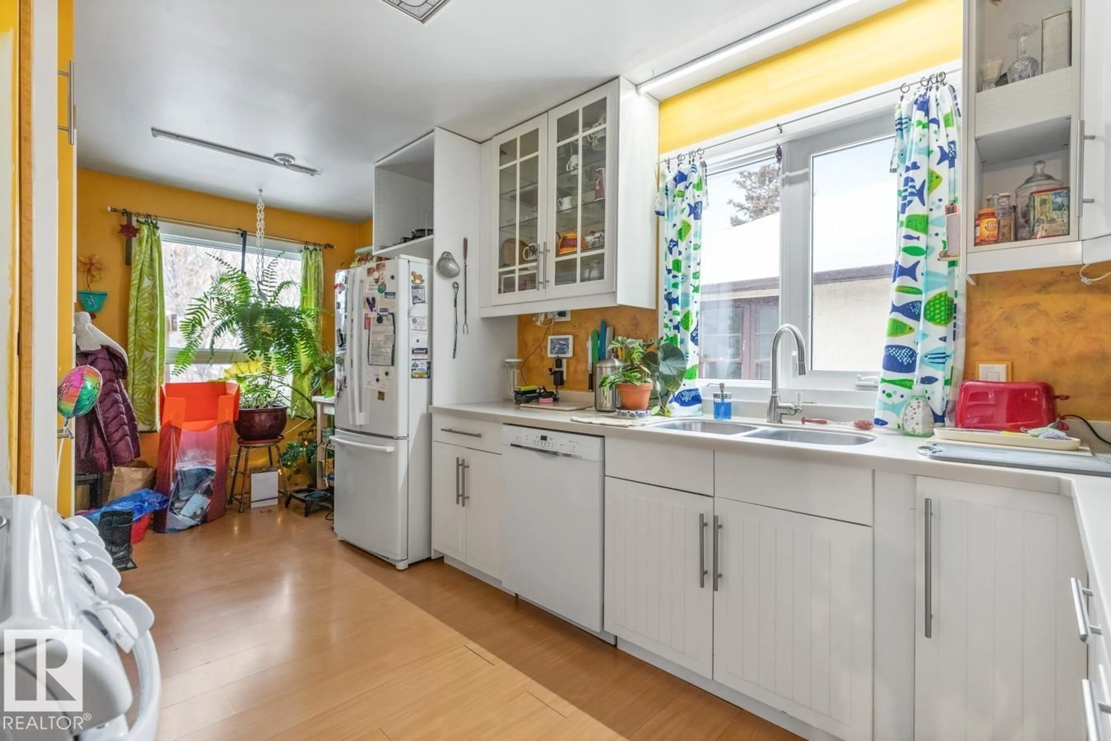 Kitchen with laundary machines, ceramic/tile floor for 9236 86 ST, Edmonton Alberta T6C3E4