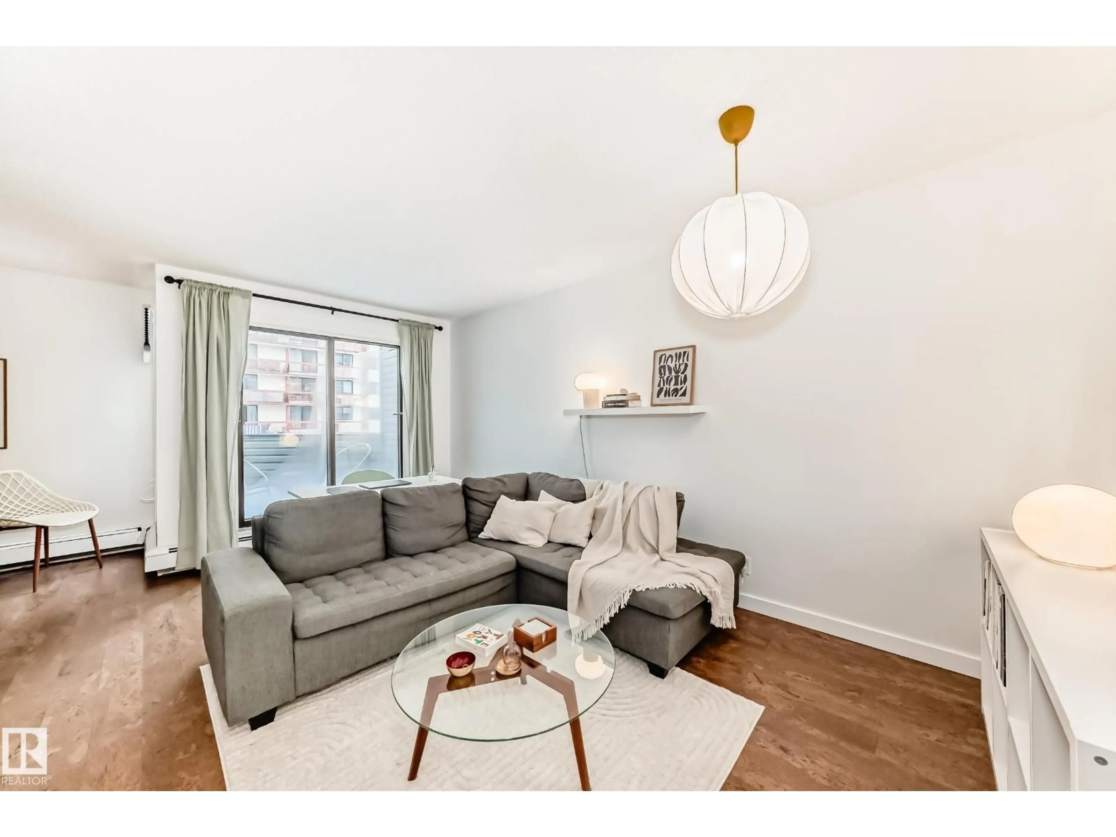 Living room with furniture, wood/laminate floor for #314 - 10148 118 ST, Edmonton Alberta T5K1Y4