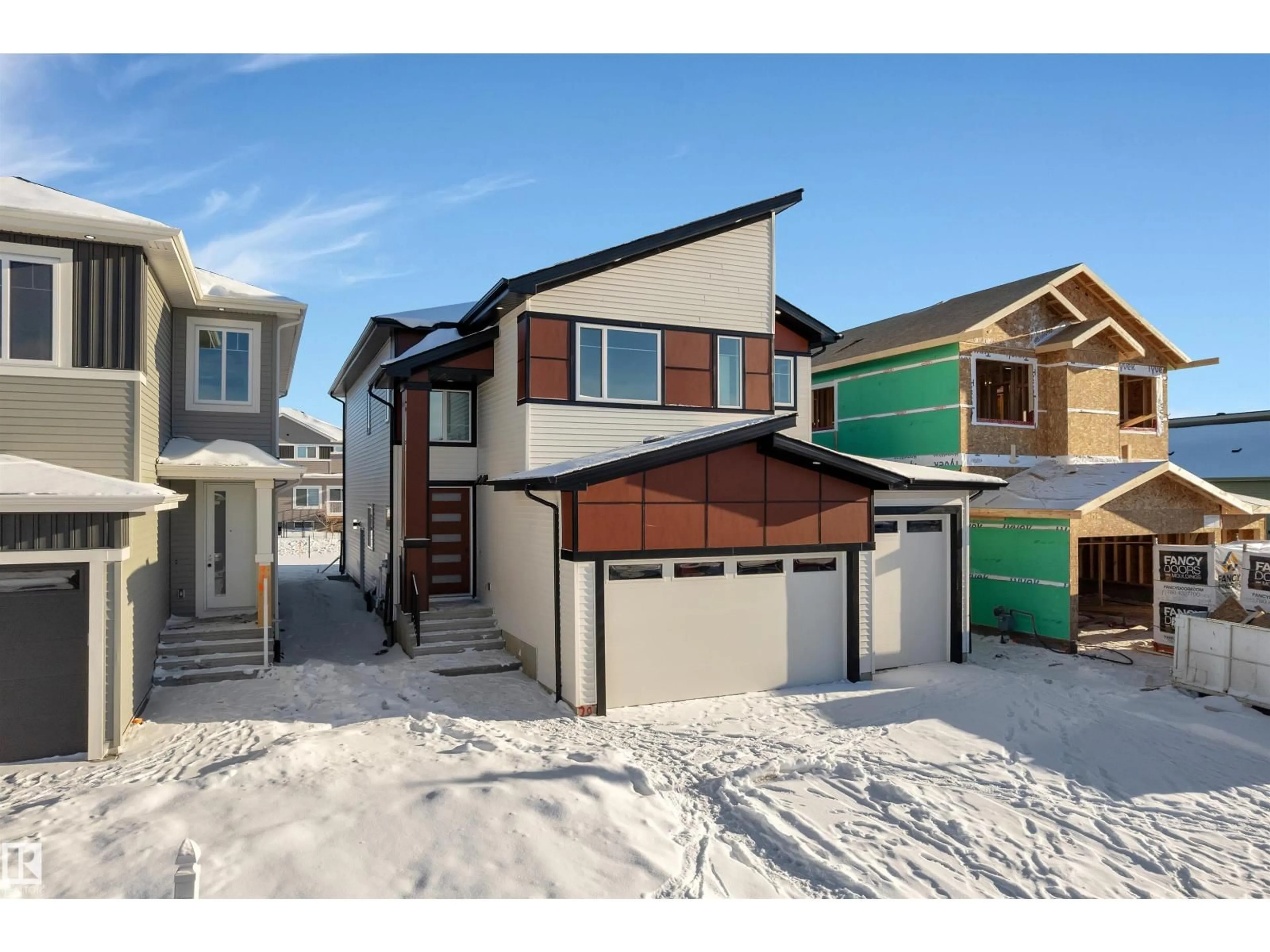 Home with vinyl exterior material, street for 207 BASIN CO, Leduc Alberta T9E1T6