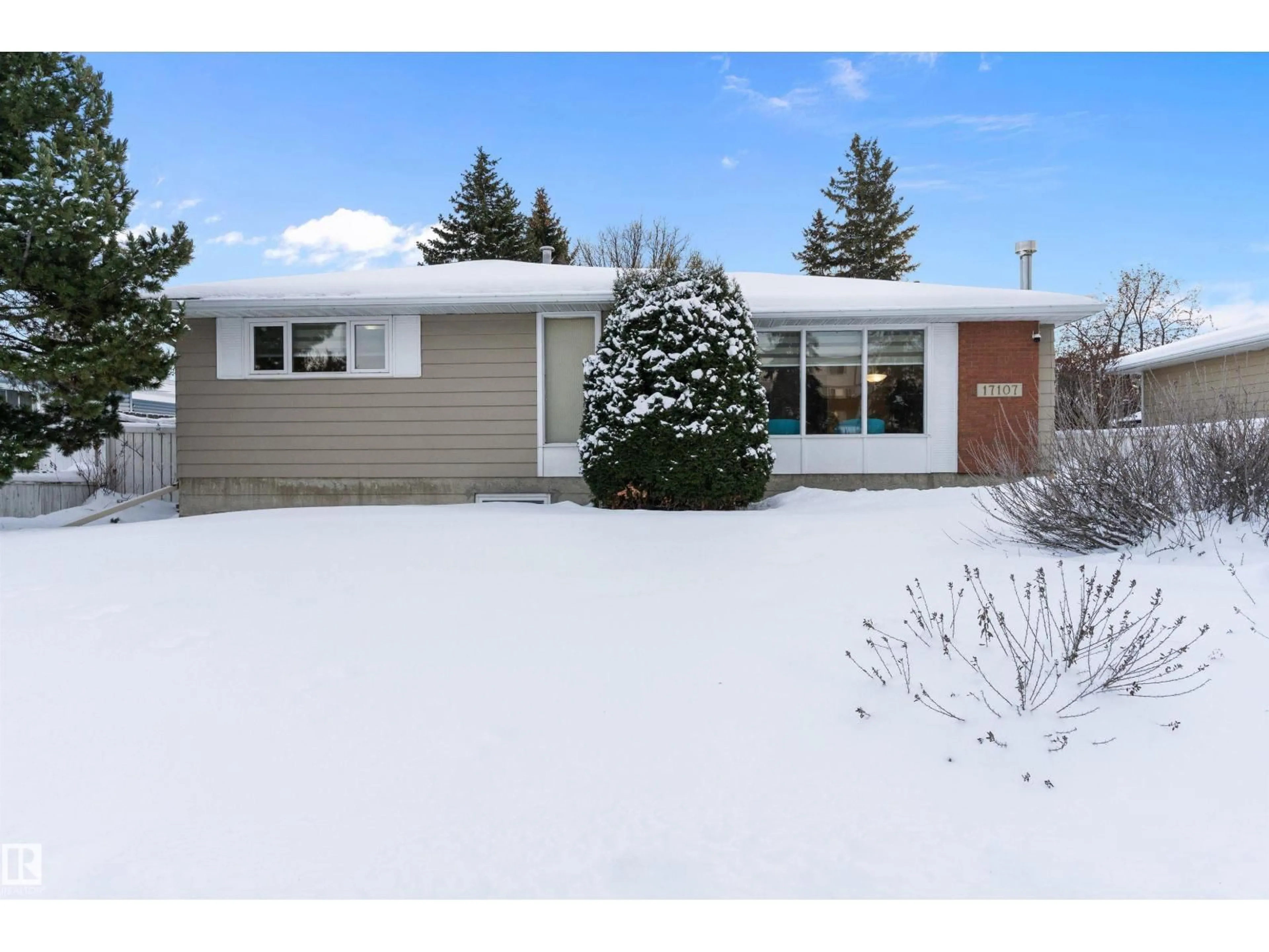 Home with vinyl exterior material, street for 17107 86 AV NW, Edmonton Alberta T5T0L3