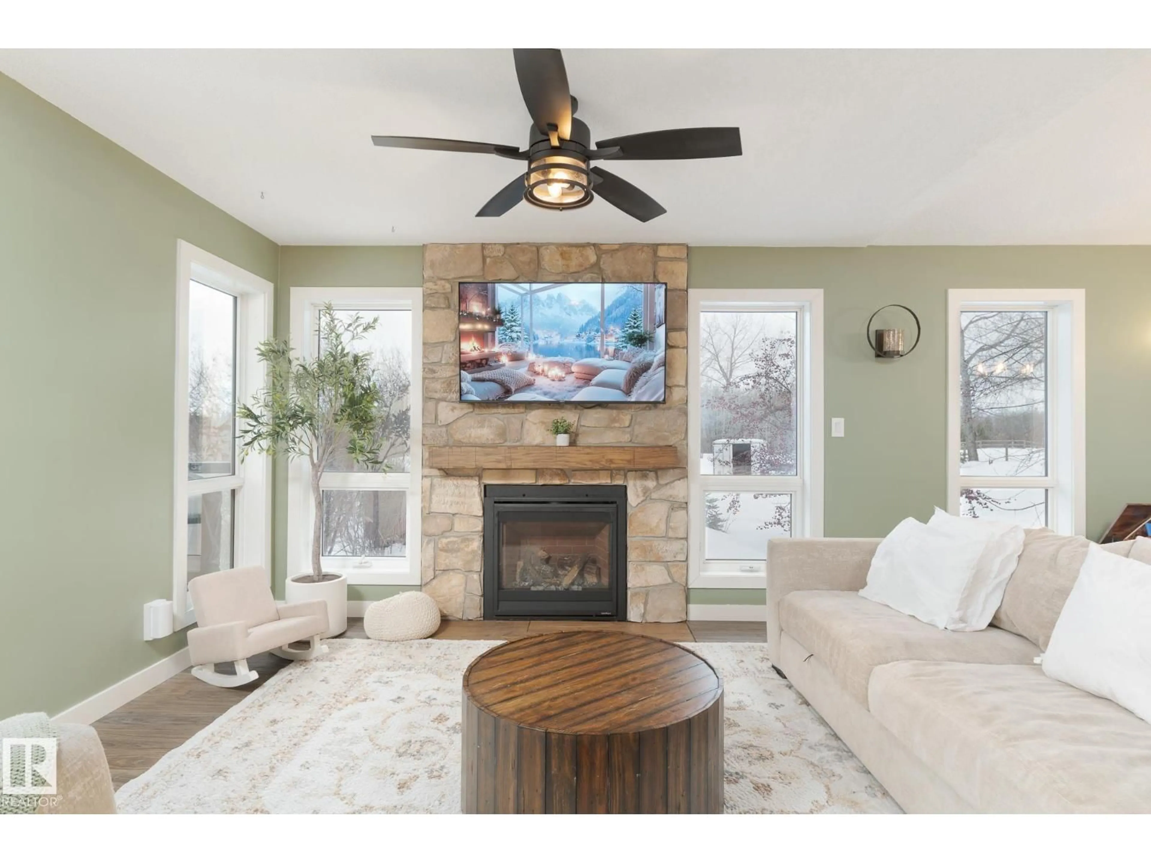 Living room with furniture, wood/laminate floor for 53218 - 20 RGE ROAD 14, Rural Parkland County Alberta T7Y9G3