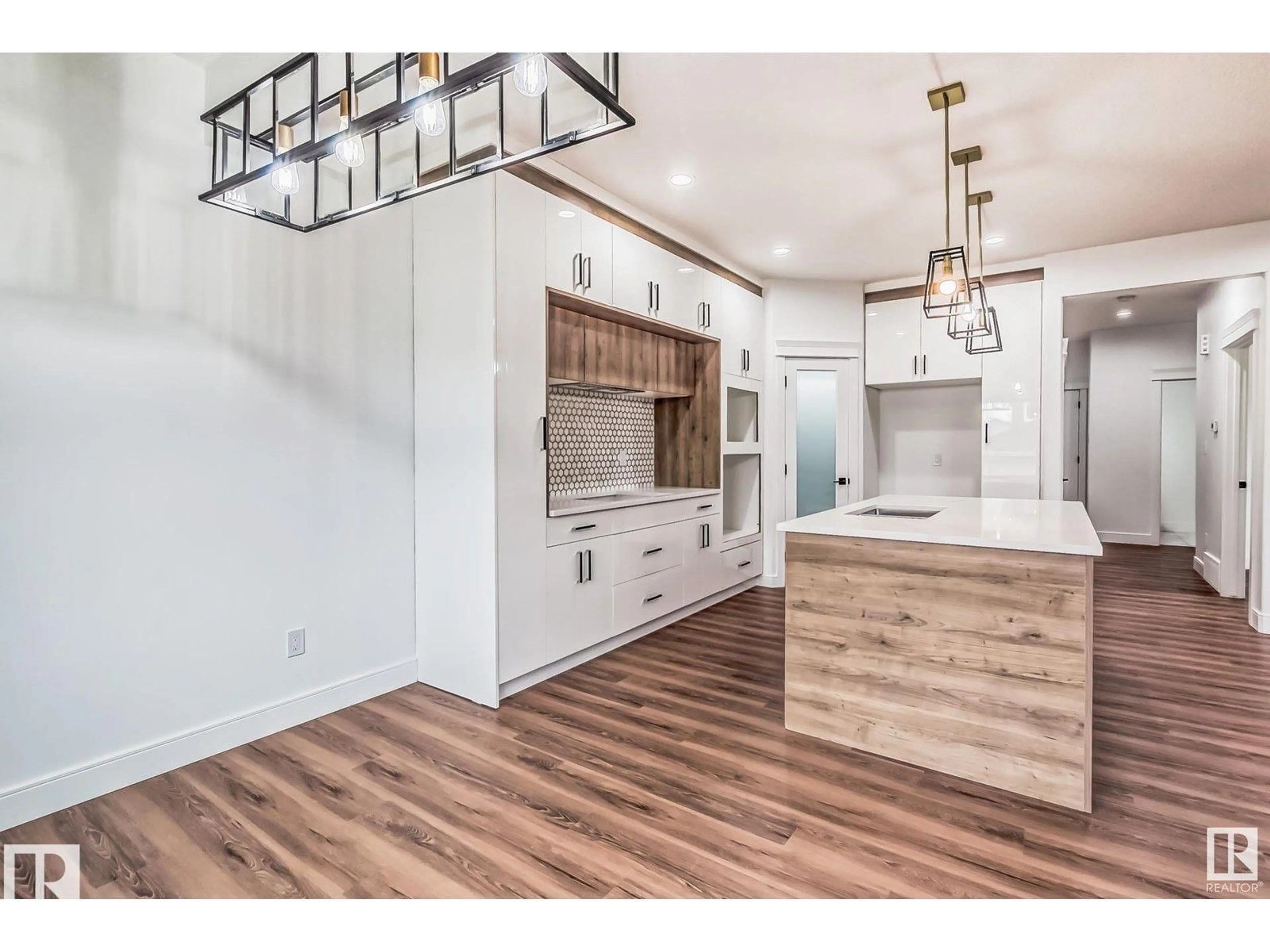 Open concept kitchen, wood/laminate floor for NW - 1703 152 AV, Edmonton Alberta T5Y2R7