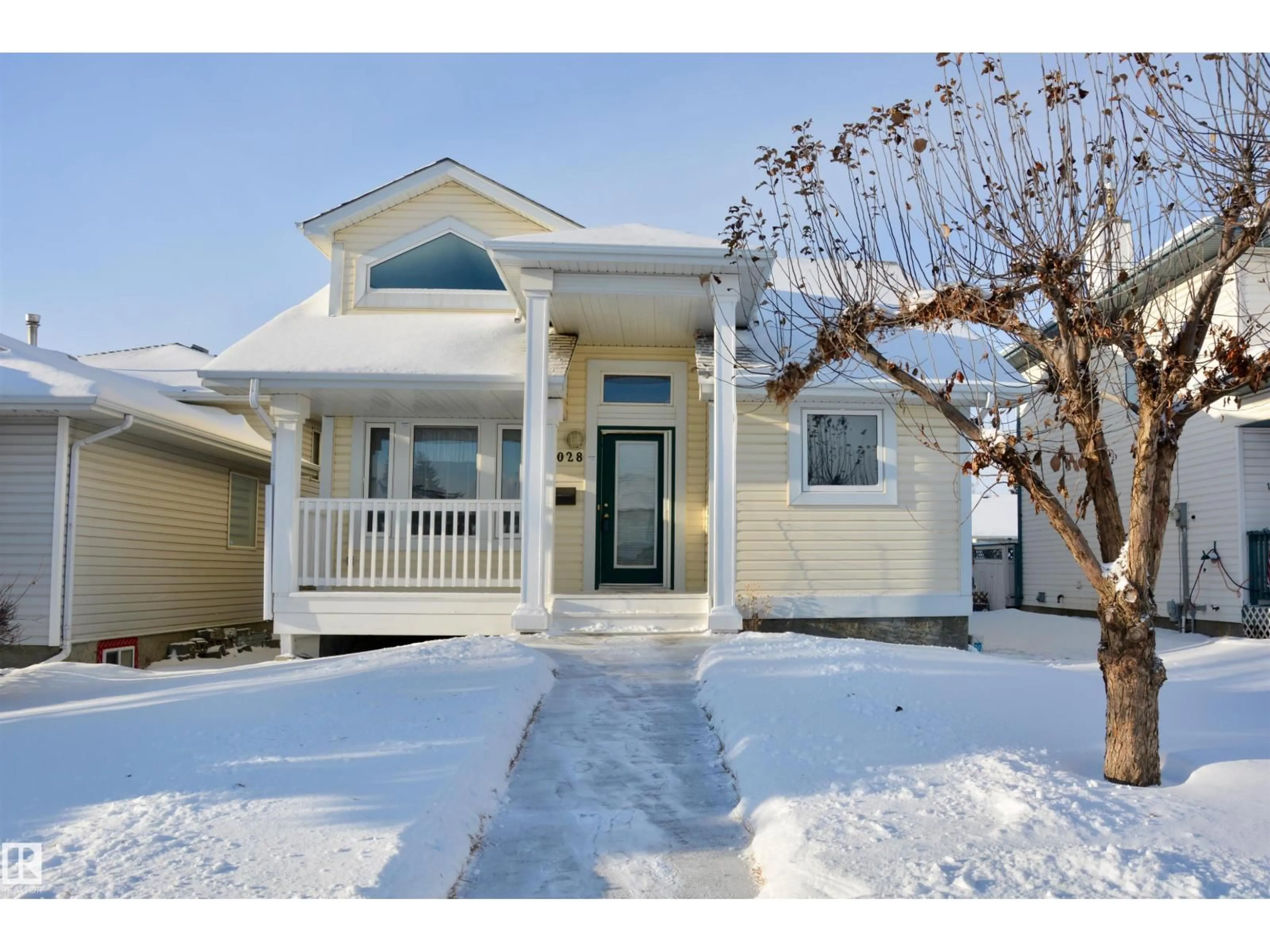 Home with vinyl exterior material, street for 15028 128 ST NW, Edmonton Alberta T6V1E9