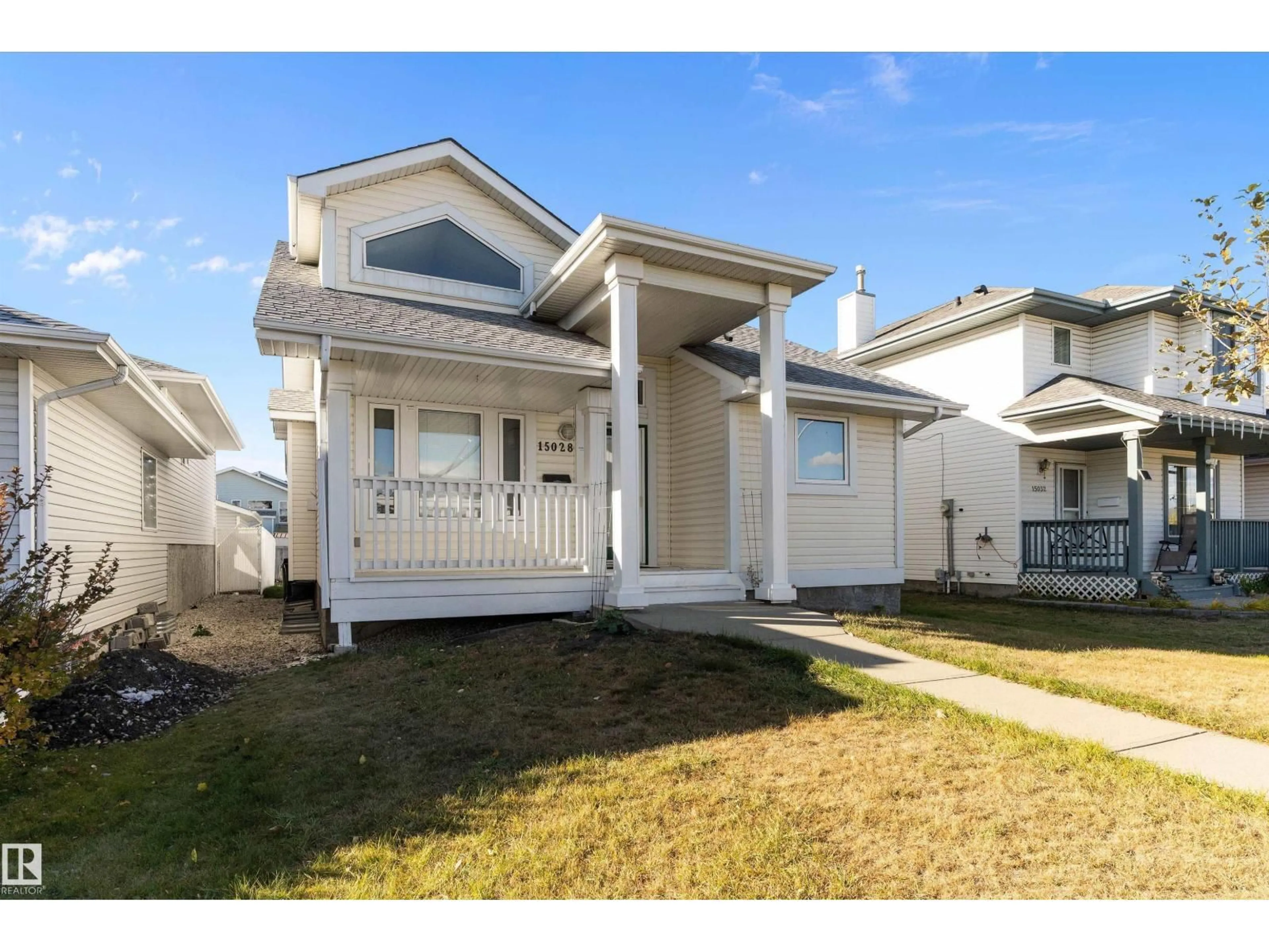 Home with vinyl exterior material, street for 15028 128 ST NW, Edmonton Alberta T6V1E9