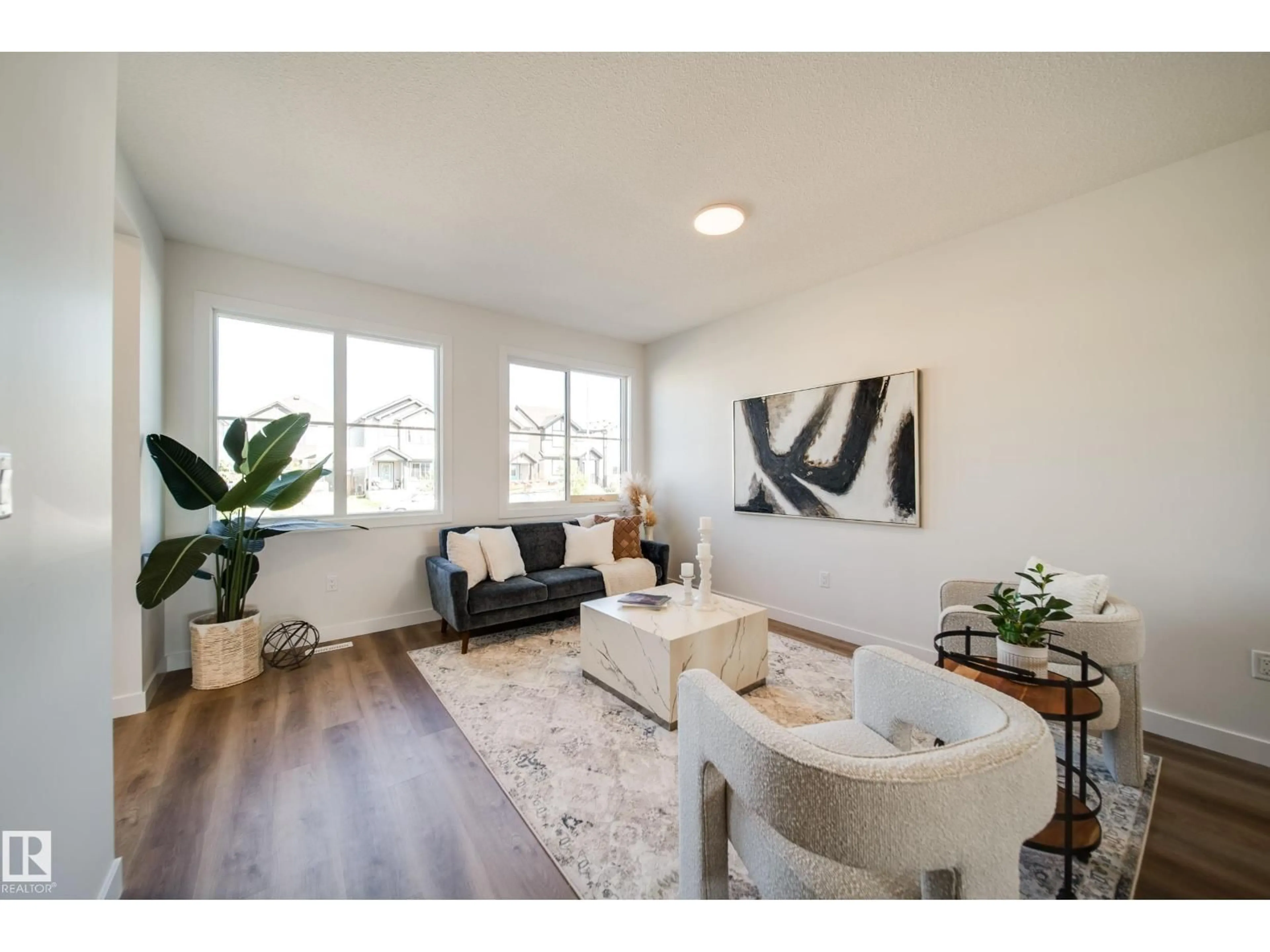 Living room with furniture, wood/laminate floor for 59 SIENNA BV, Fort Saskatchewan Alberta T8L0W3