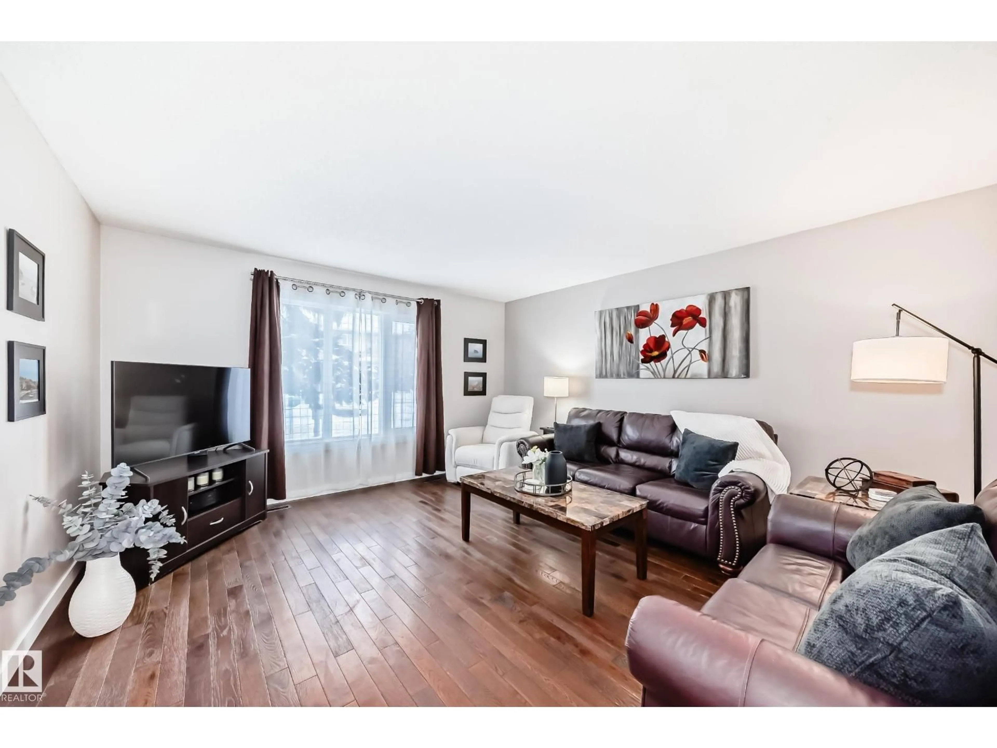 Living room with furniture, wood/laminate floor for NW - 16413 115 ST, Edmonton Alberta T5X5E8