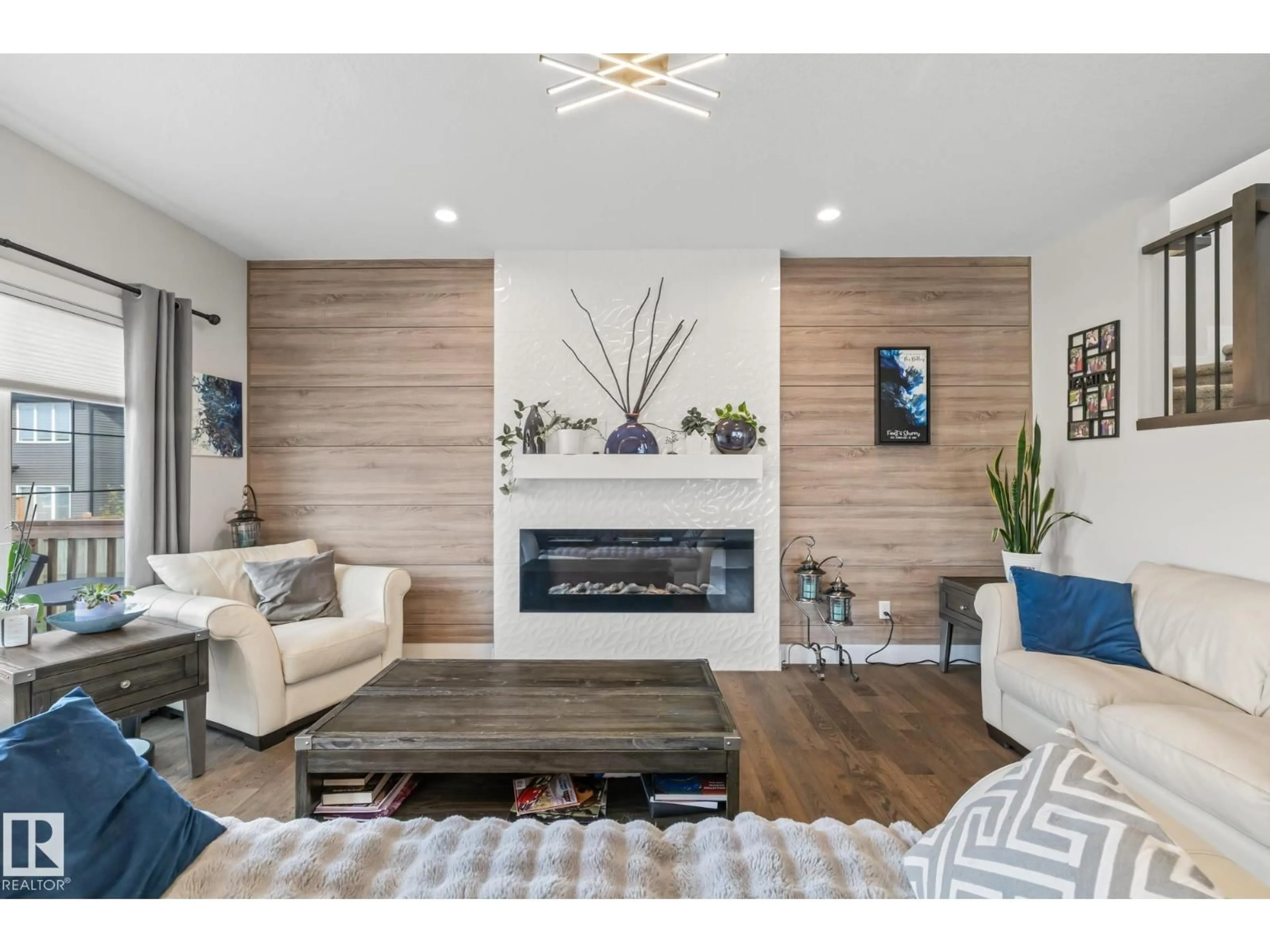 Living room with furniture, wood/laminate floor for 568 MERLIN LANDING LD, Edmonton Alberta T5S0L9