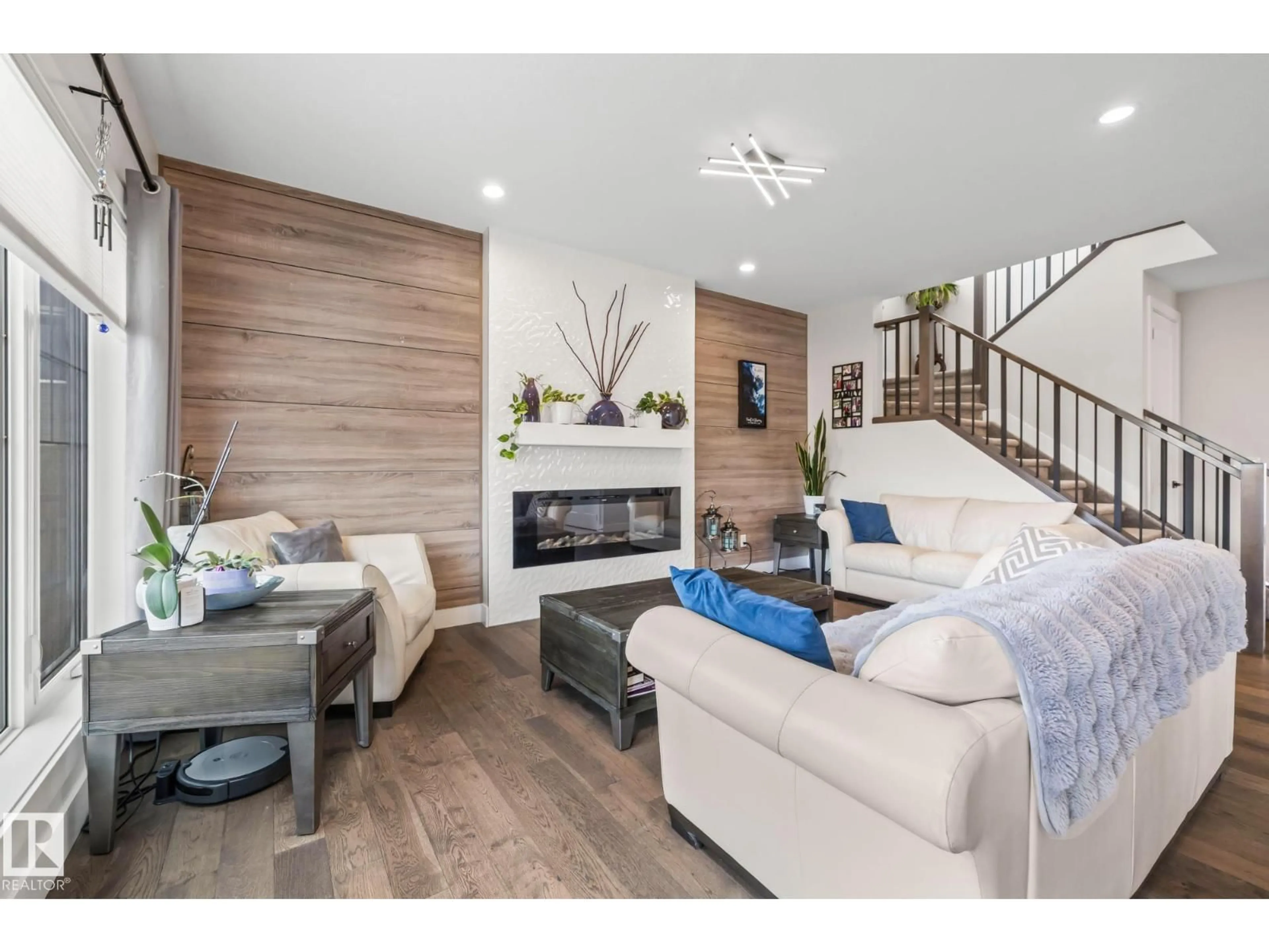 Living room with furniture, wood/laminate floor for 568 MERLIN LANDING LD, Edmonton Alberta T5S0L9