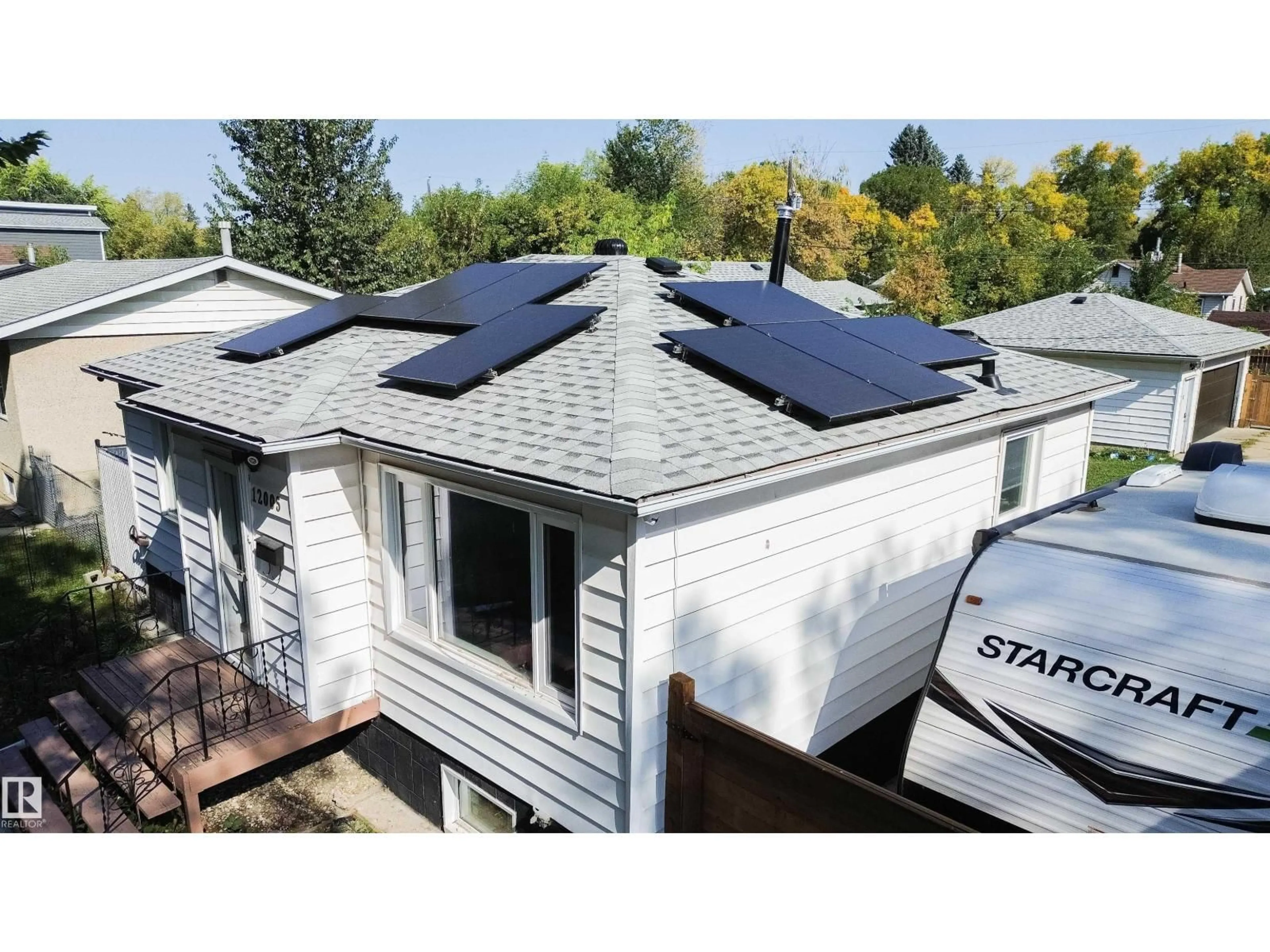 Home with vinyl exterior material, street for NW - 12005 40 ST, Edmonton Alberta T5W2L2