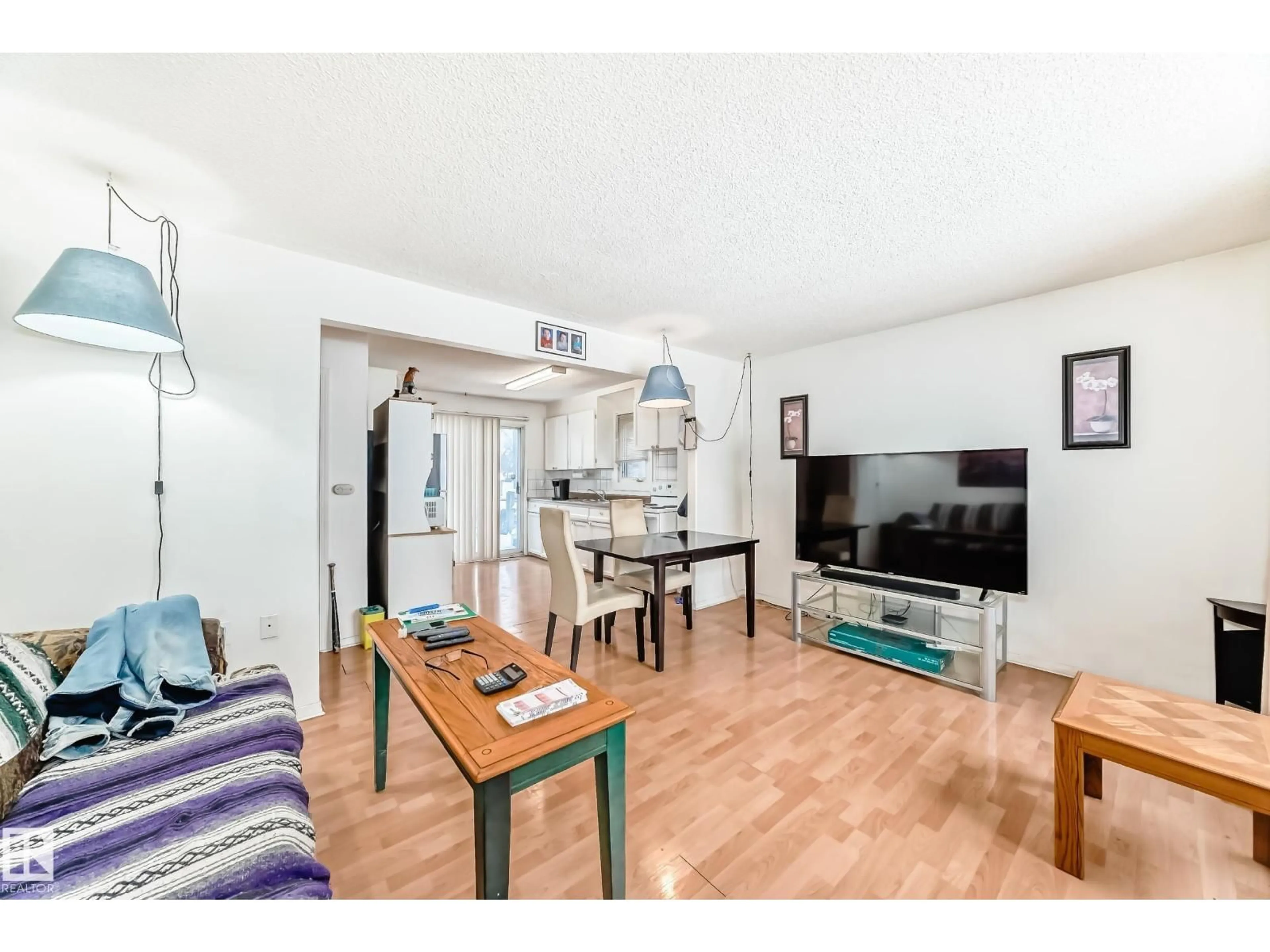 Living room with furniture, wood/laminate floor for 15515 92A AV, Edmonton Alberta T5R5E8