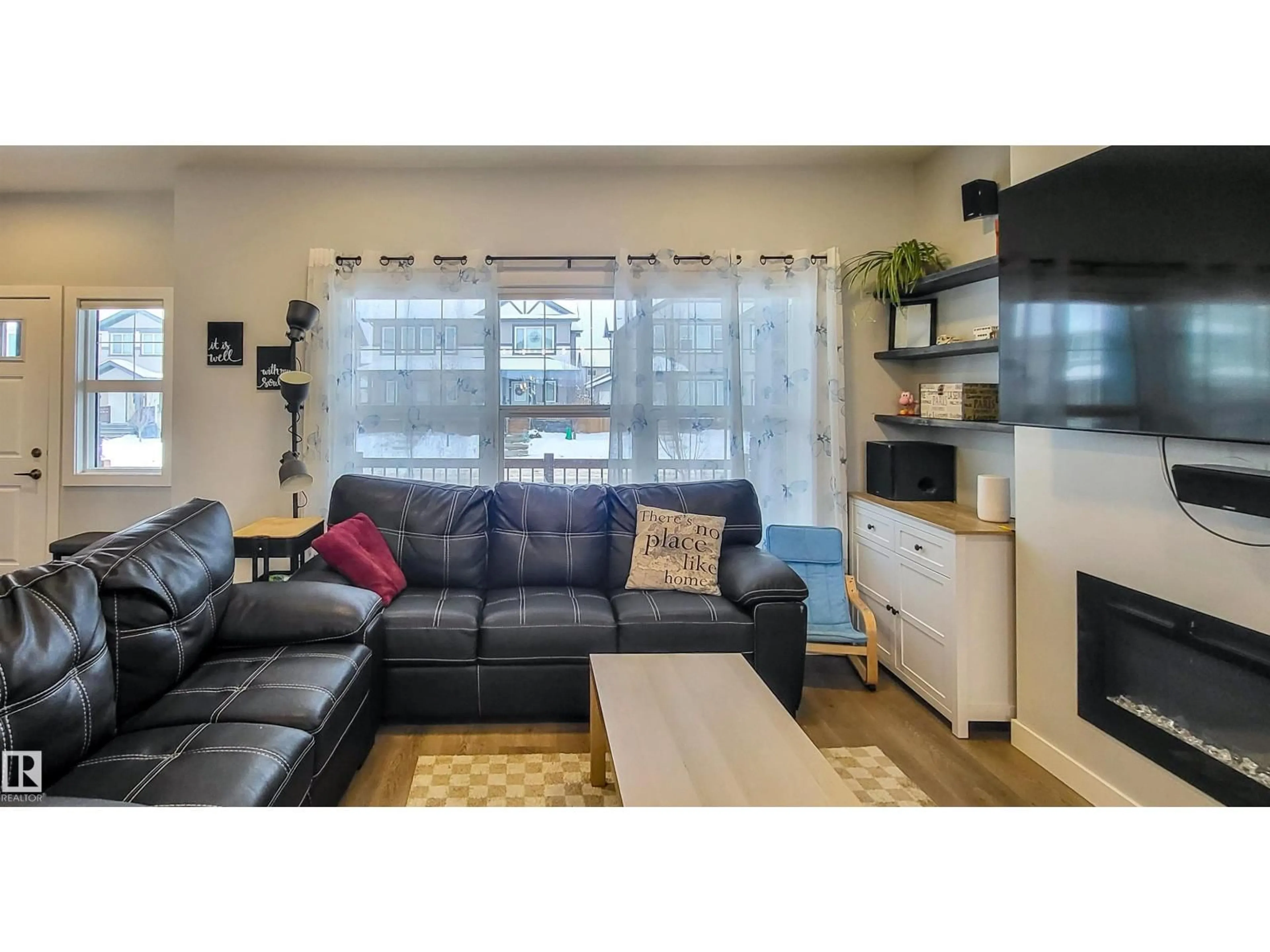 Living room with furniture, wood/laminate floor for 663 LEWIS GREENS DR, Edmonton Alberta T5T7G3