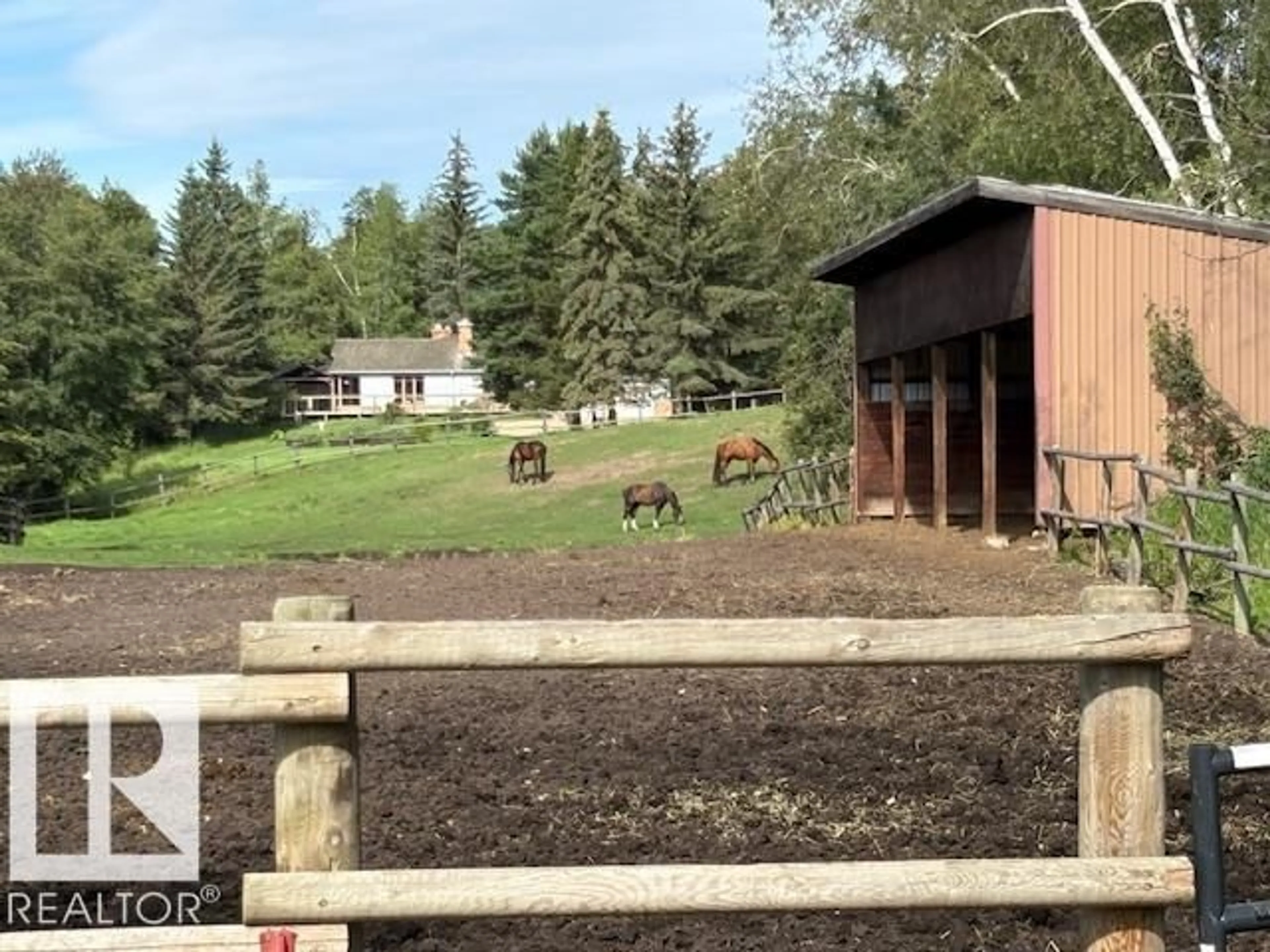 A pic from outside/outdoor area/front of a property/back of a property/a pic from drone, mountain view for 26113 TWP RD 514, Rural Parkland County Alberta T7Y1B5