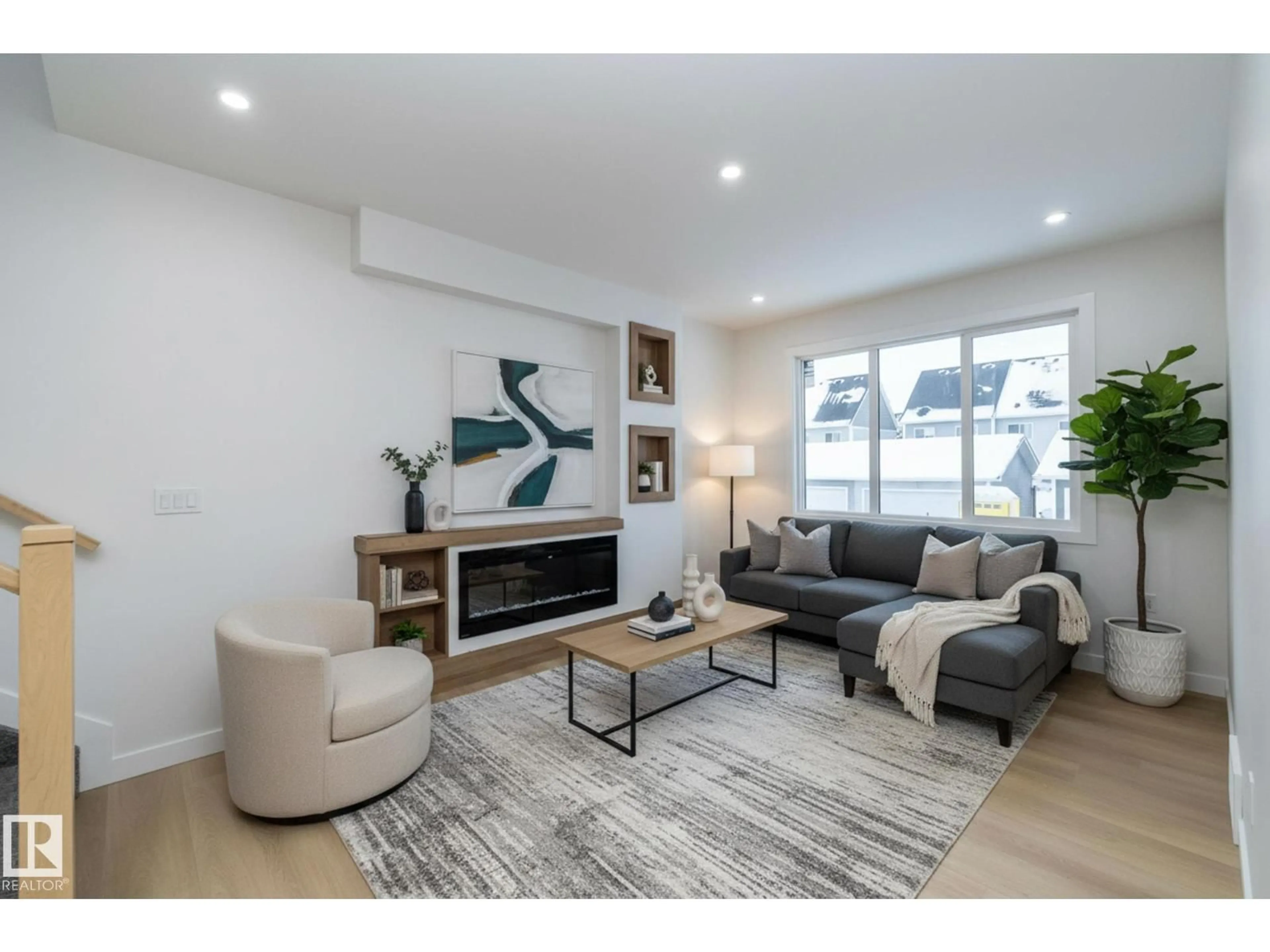 Living room with furniture, wood/laminate floor for 9805 106 AV, Morinville Alberta T8R2P2