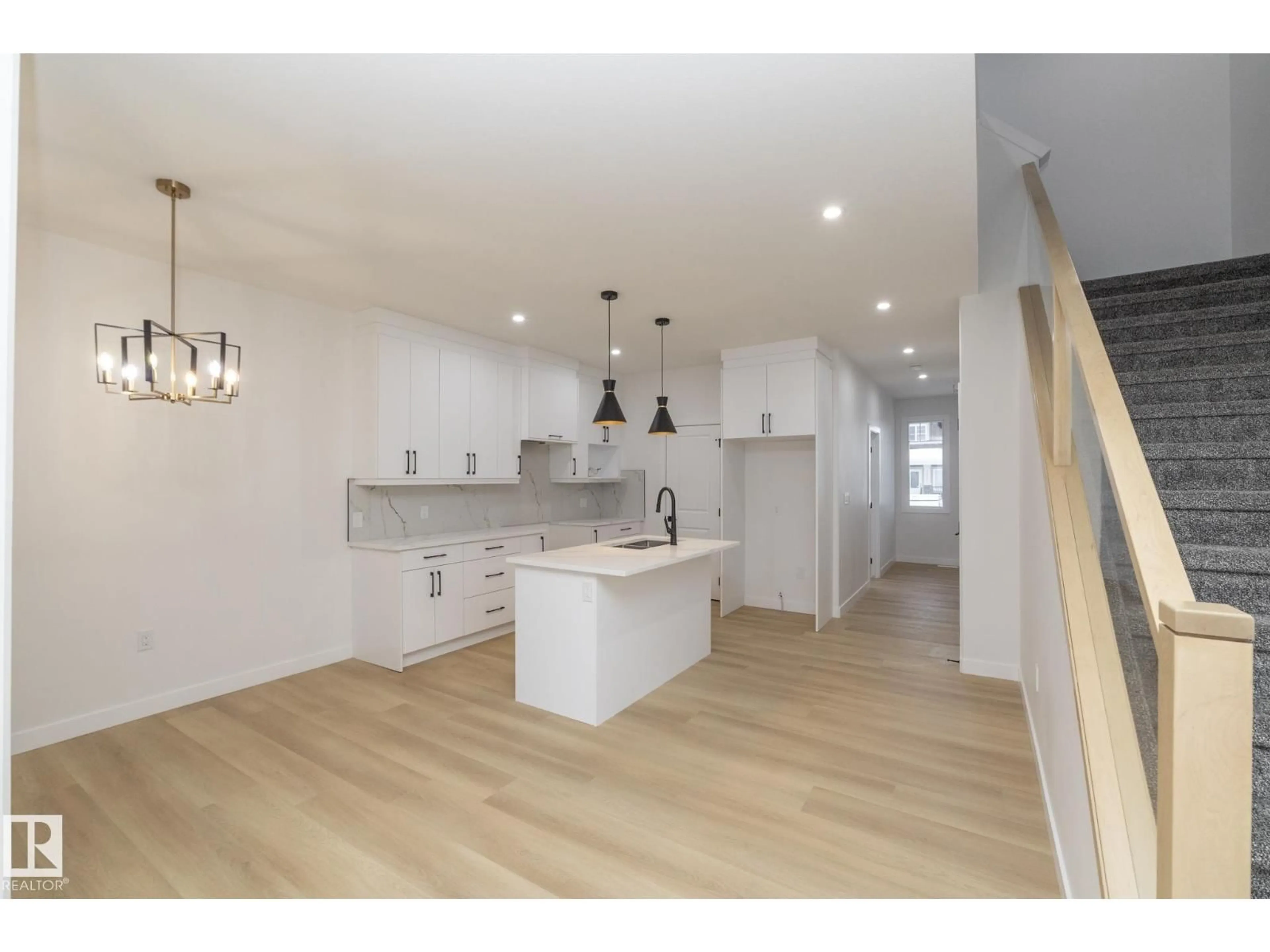 Open concept kitchen, wood/laminate floor for 9805 106 AV, Morinville Alberta T8R2P2