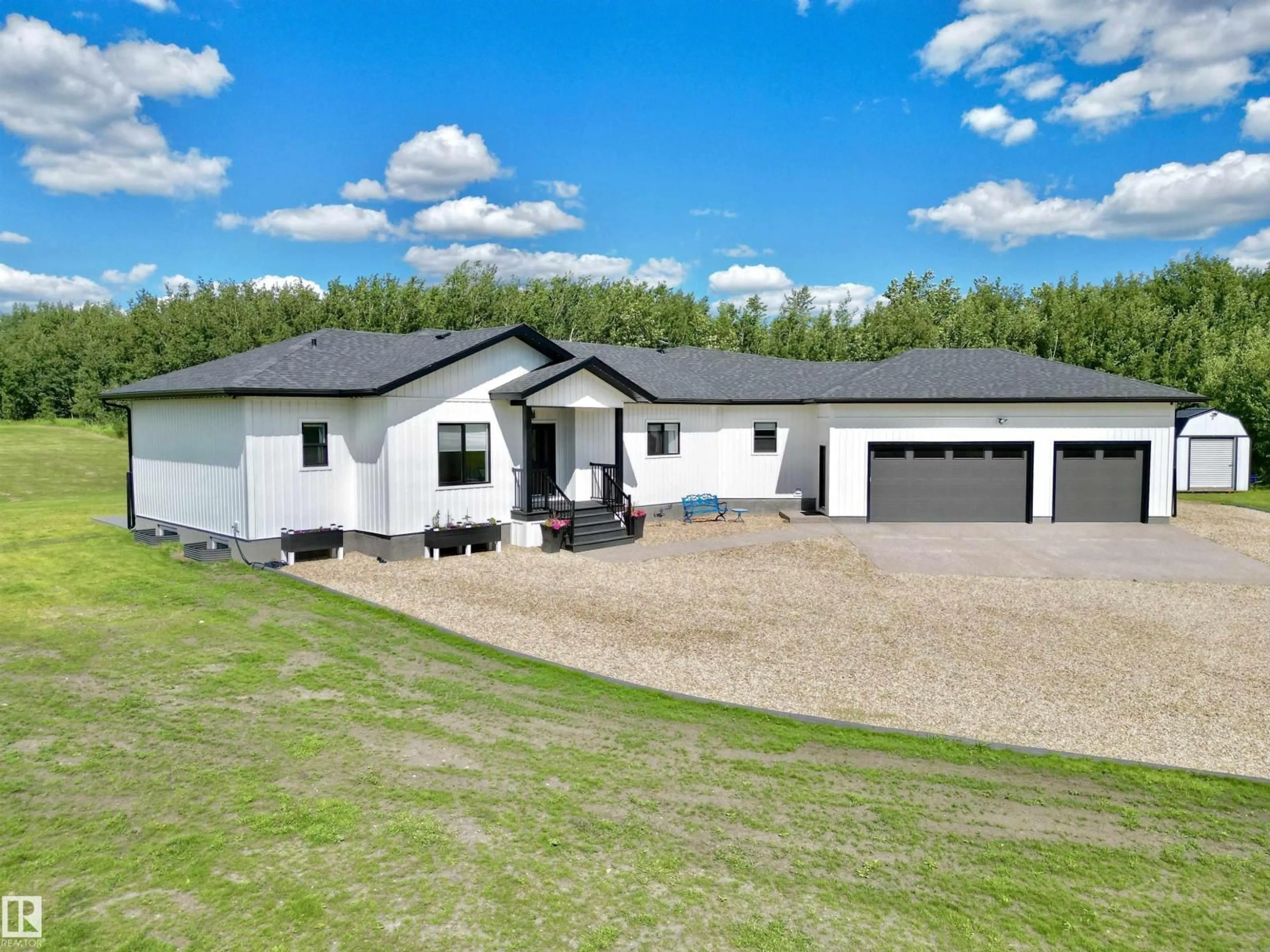 A pic from outside/outdoor area/front of a property/back of a property/a pic from drone, unknown for 197 - 50072 RANGE ROAD 205, Rural Camrose County Alberta T0B2M1