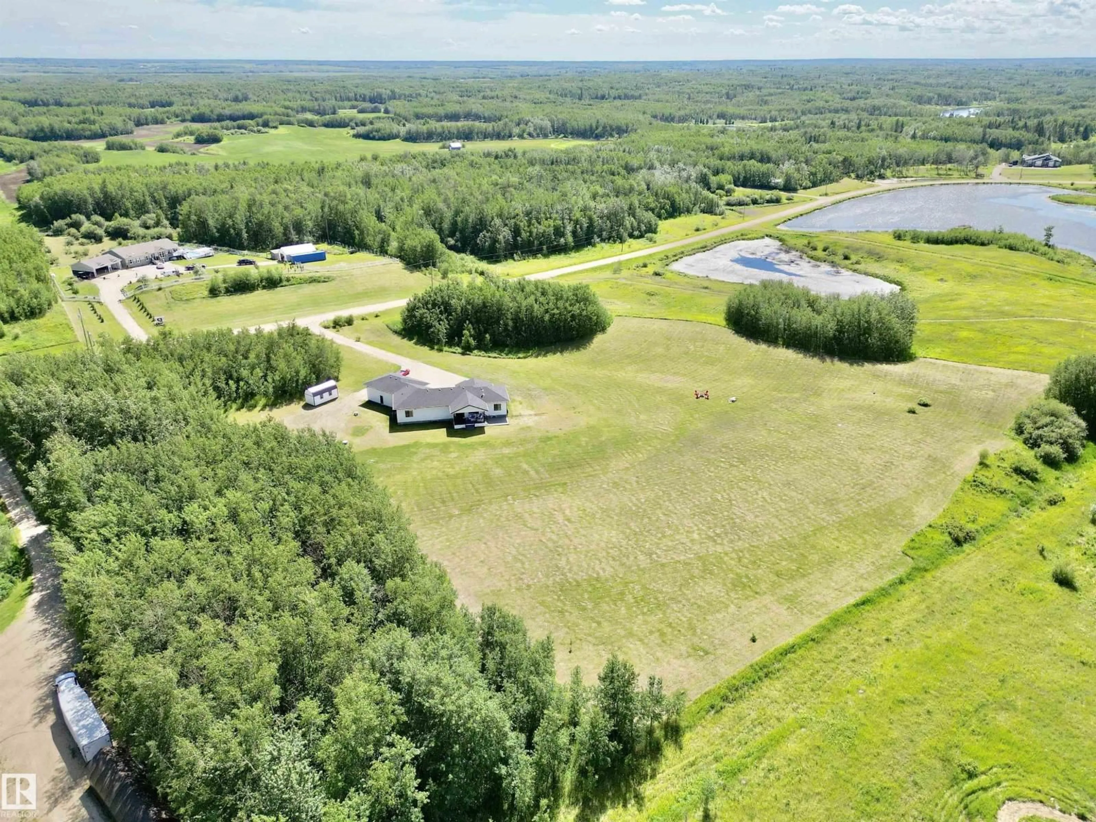 A pic from outside/outdoor area/front of a property/back of a property/a pic from drone, water/lake/river/ocean view for 197 - 50072 RANGE ROAD 205, Rural Camrose County Alberta T0B2M1