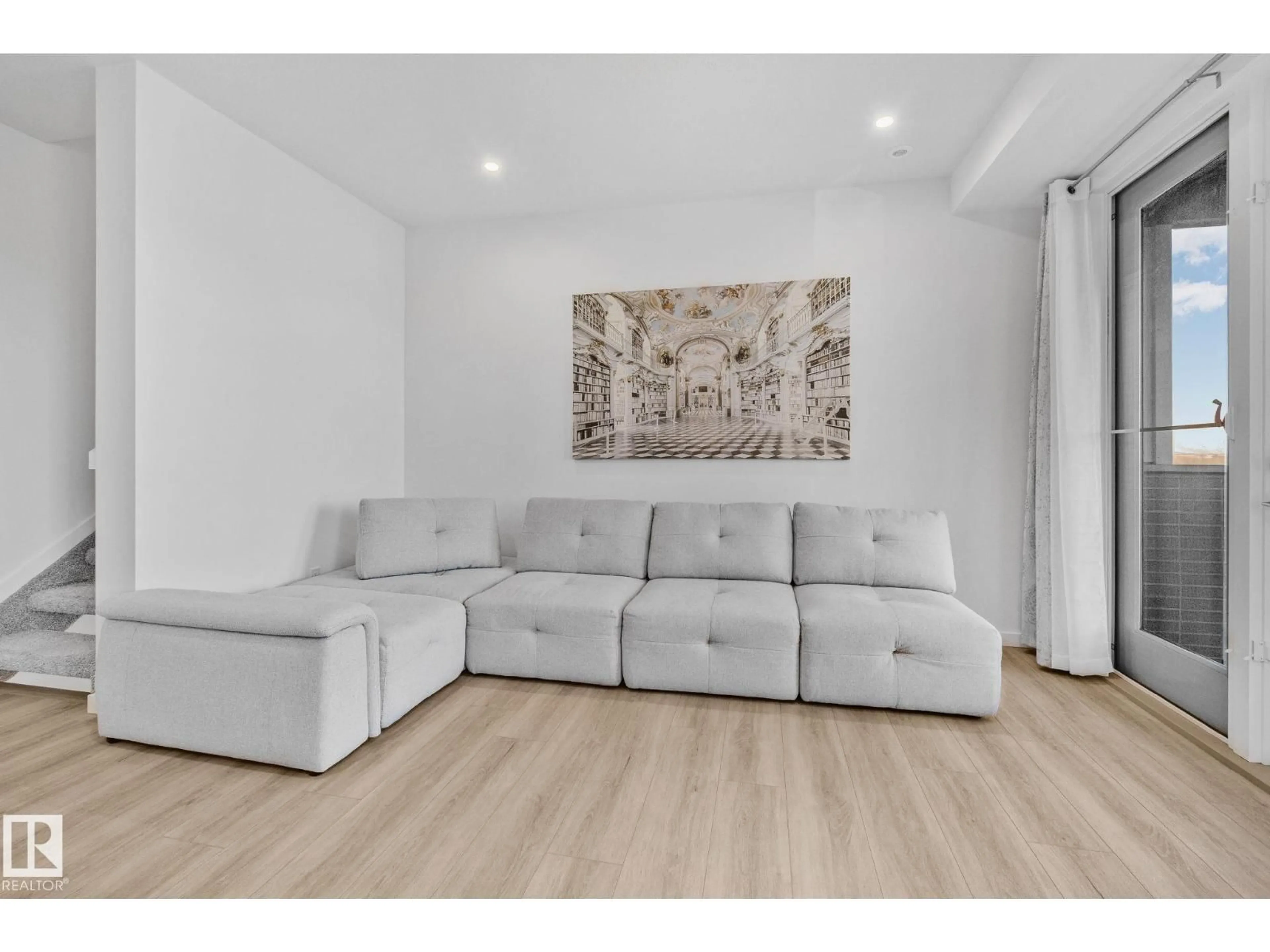 Living room with furniture, wood/laminate floor for 5 - 84 RONDEAU DR, St. Albert Alberta T8N7X8