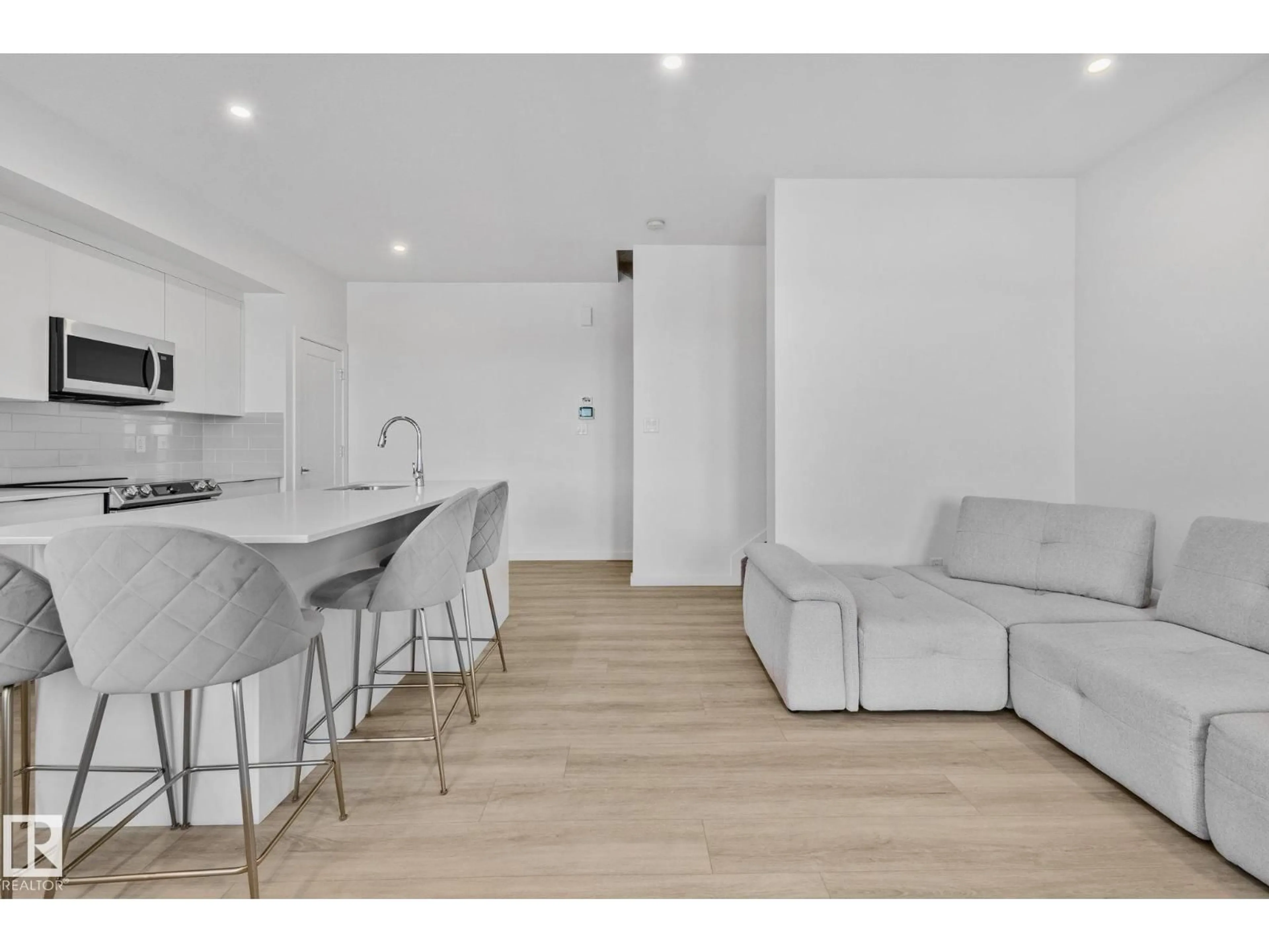 Open concept kitchen, wood/laminate floor for 5 - 84 RONDEAU DR, St. Albert Alberta T8N7X8