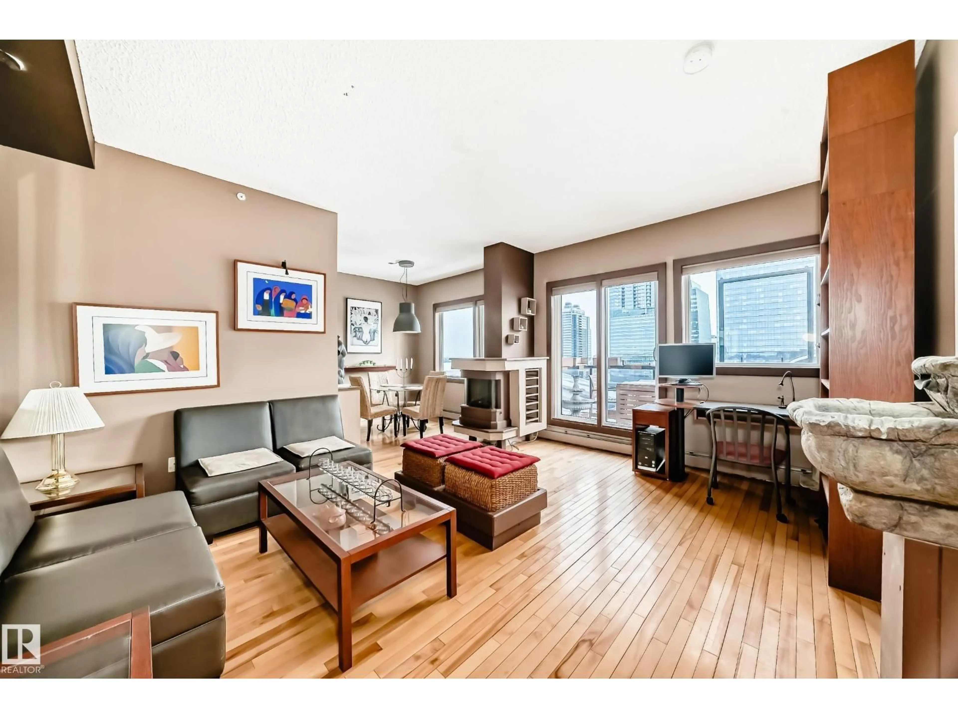 Living room with furniture, wood/laminate floor for 10303 - 2006 105 ST NW, Edmonton Alberta T3M1M7