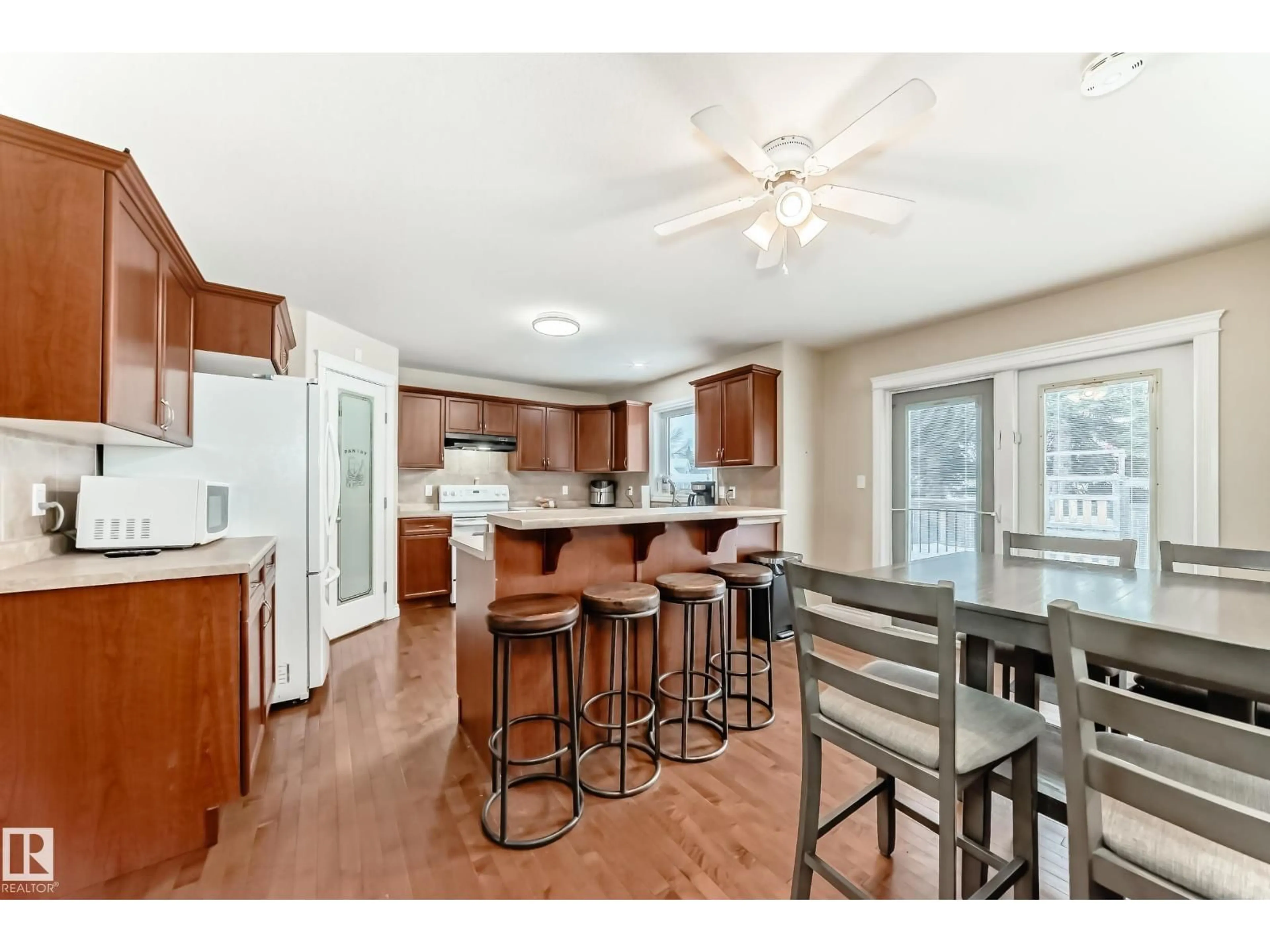 Open concept kitchen, wood/laminate floor for 5113 BON ACRES CR, Bon Accord Alberta T0A0K0