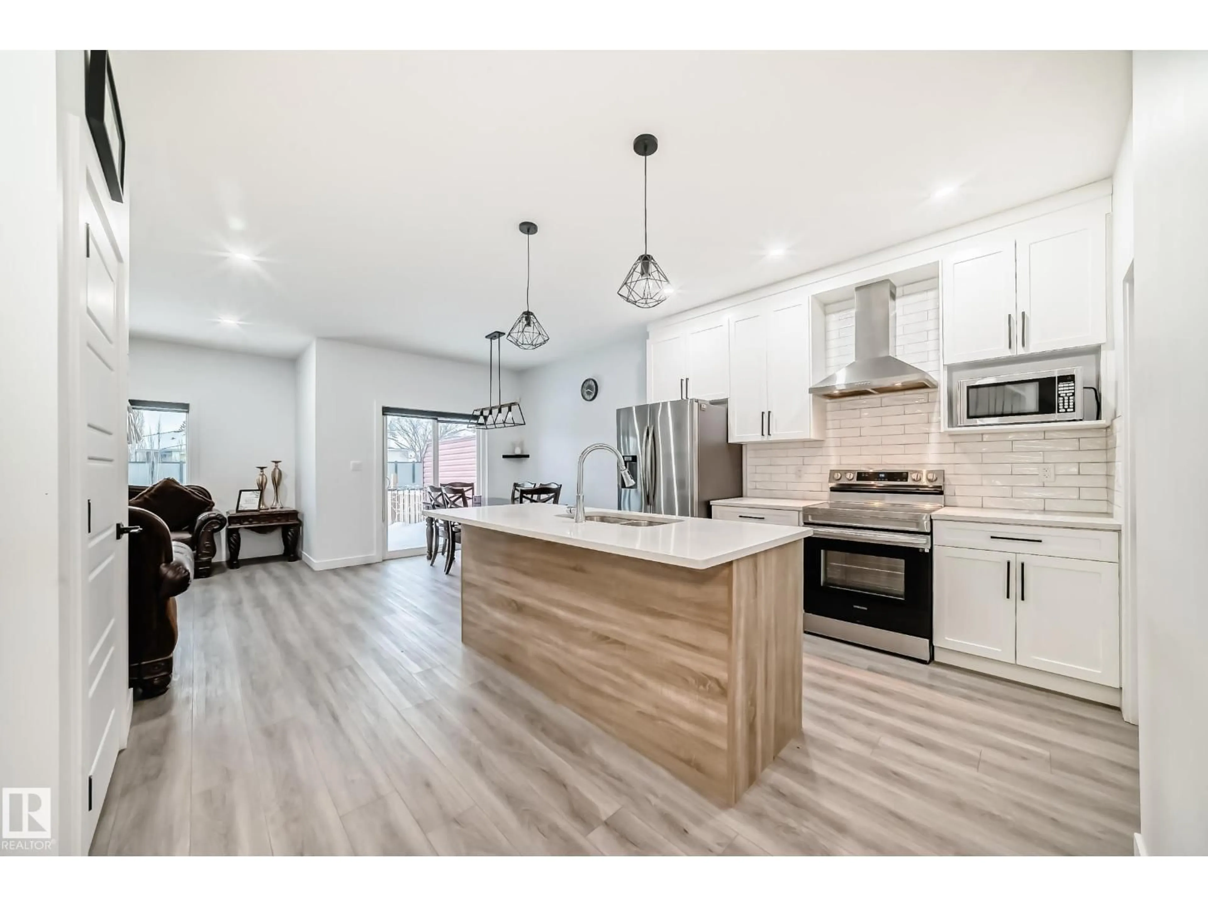 Open concept kitchen, wood/laminate floor for 563 KLEINS CR, Leduc Alberta T9E1J4