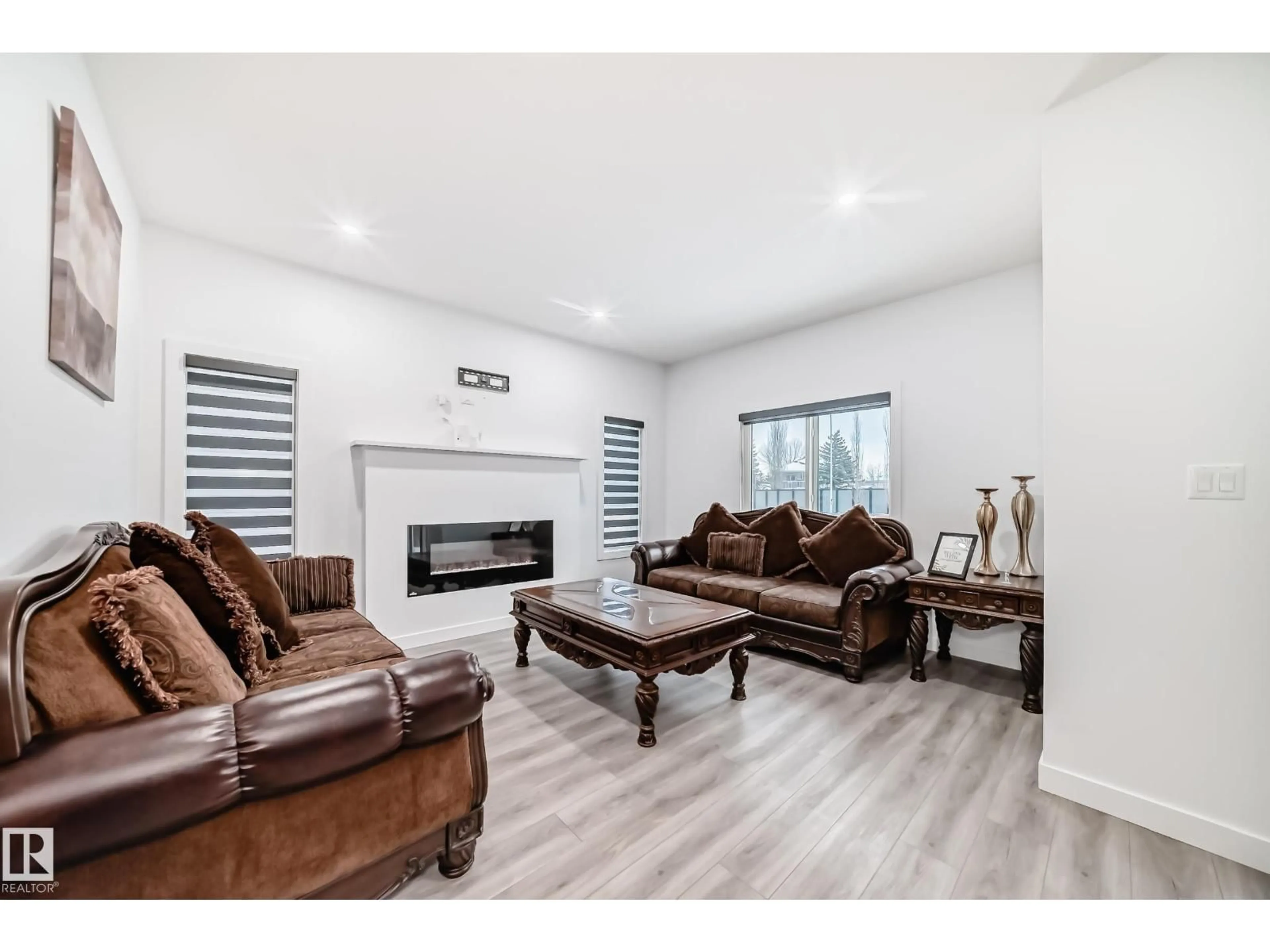 Living room with furniture, wood/laminate floor for 563 KLEINS CR, Leduc Alberta T9E1J4