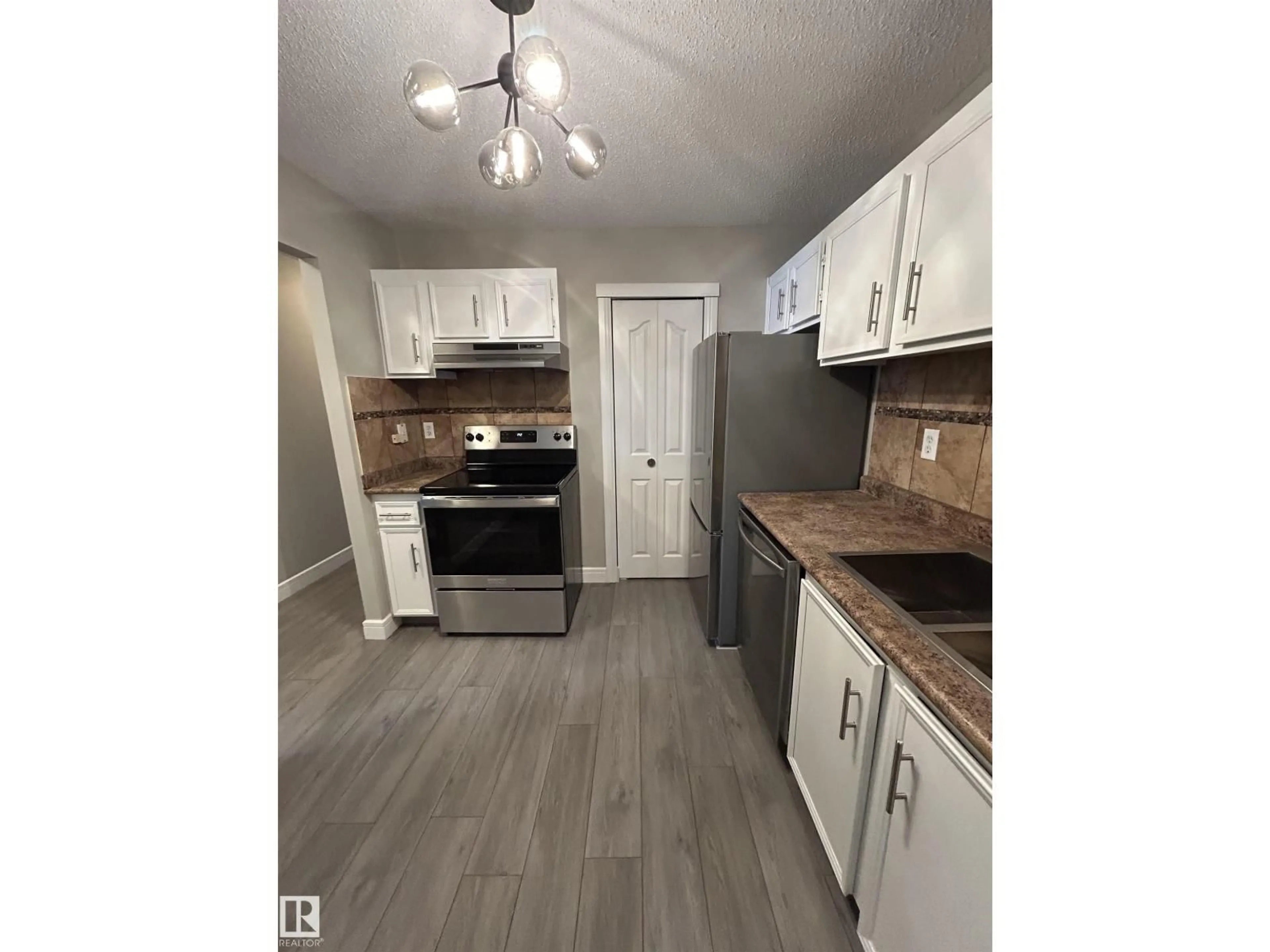 Standard kitchen, wood/laminate floor for 53 14620 26 ST NW, Edmonton Alberta T5Y2J9