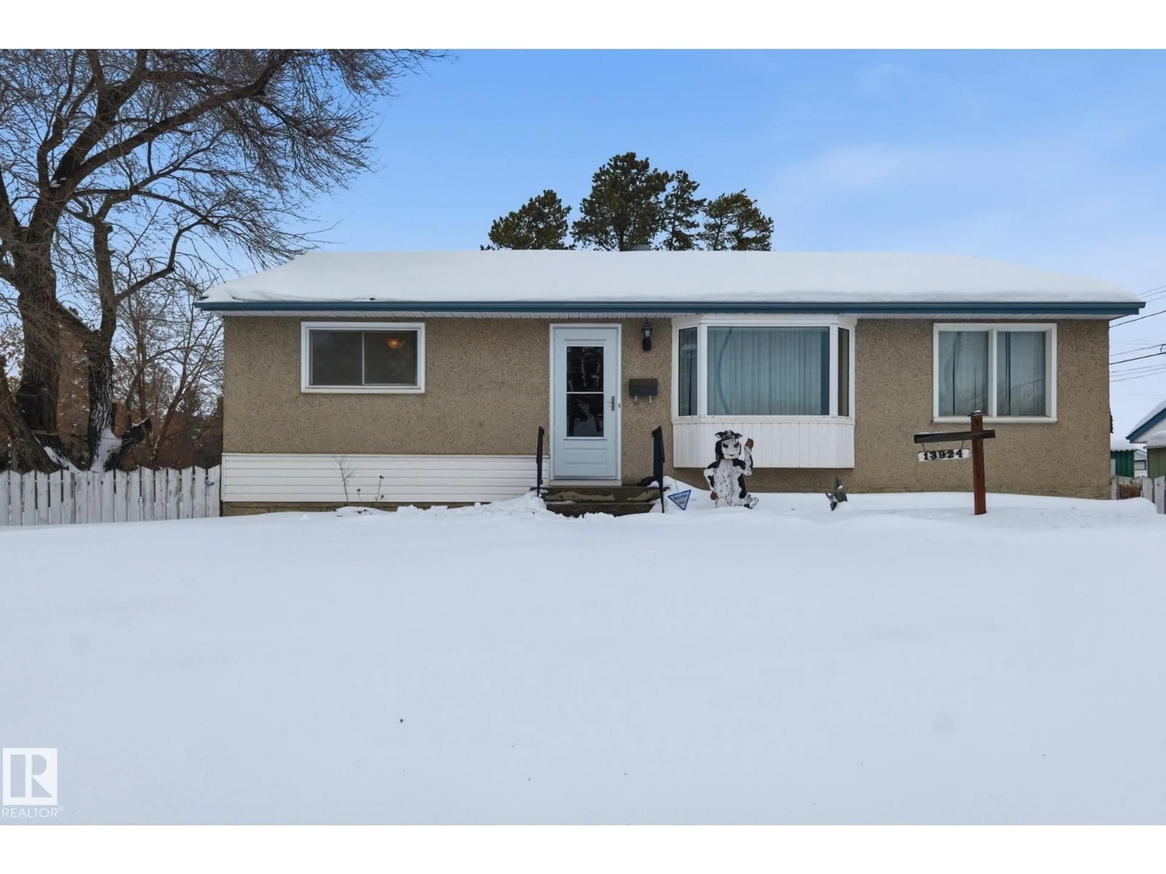 Home with vinyl exterior material, street for 13924 135 AV, Edmonton Alberta T5L3Y8