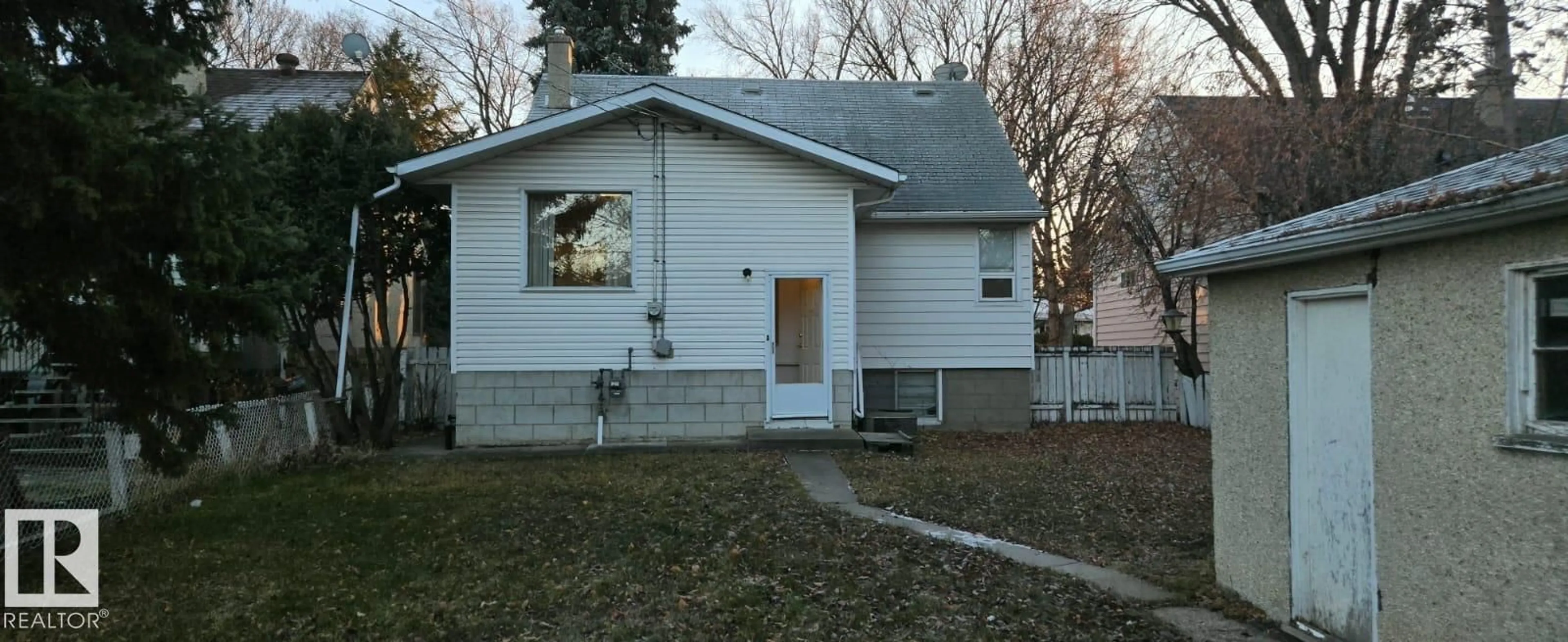 Home with vinyl exterior material, street for NW - 11234 71 AV, Edmonton Alberta T6G0A6