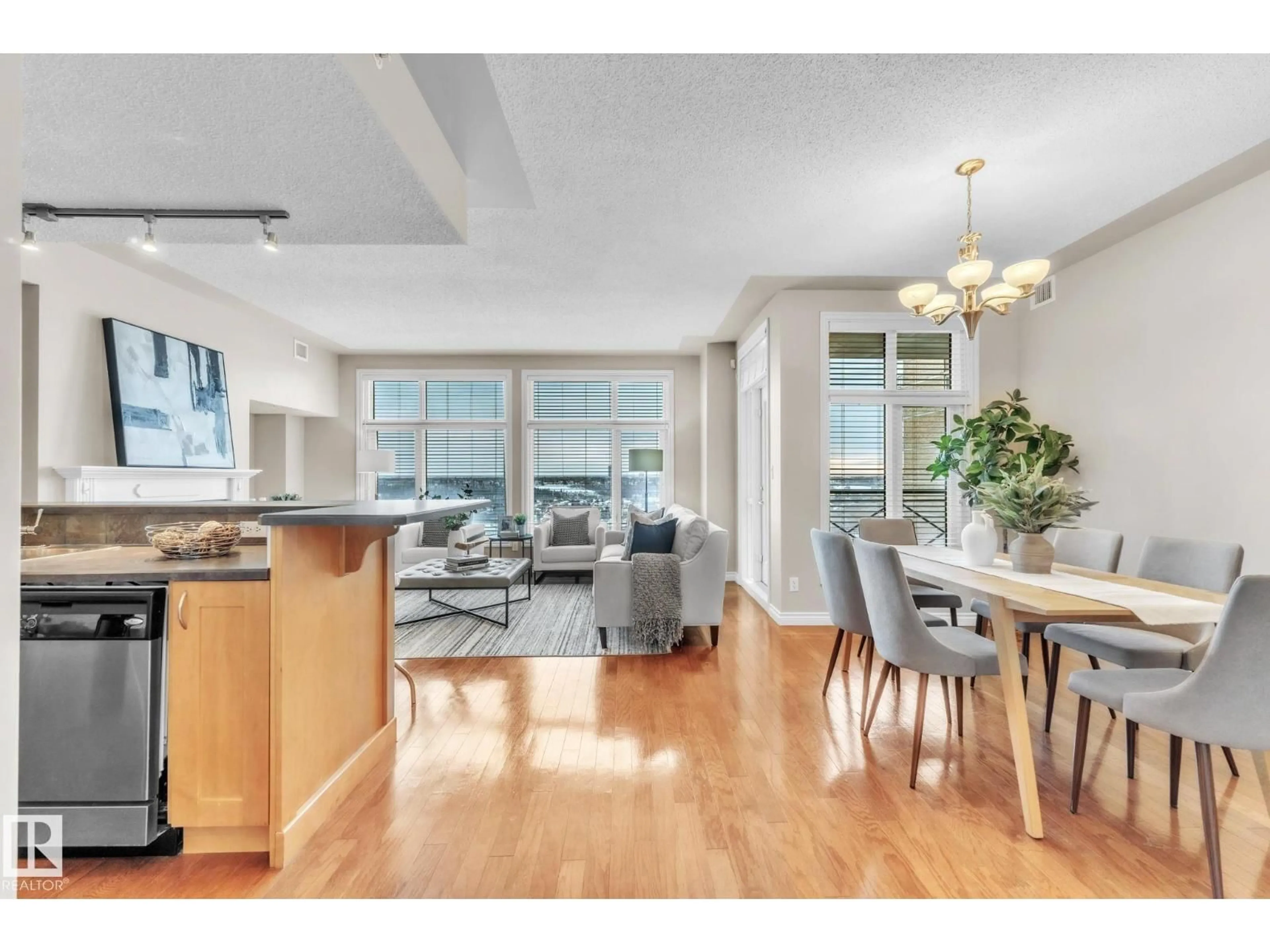 Open concept kitchen, wood/laminate floor for #706 - 9020 JASPER AV, Edmonton Alberta T5H3S8