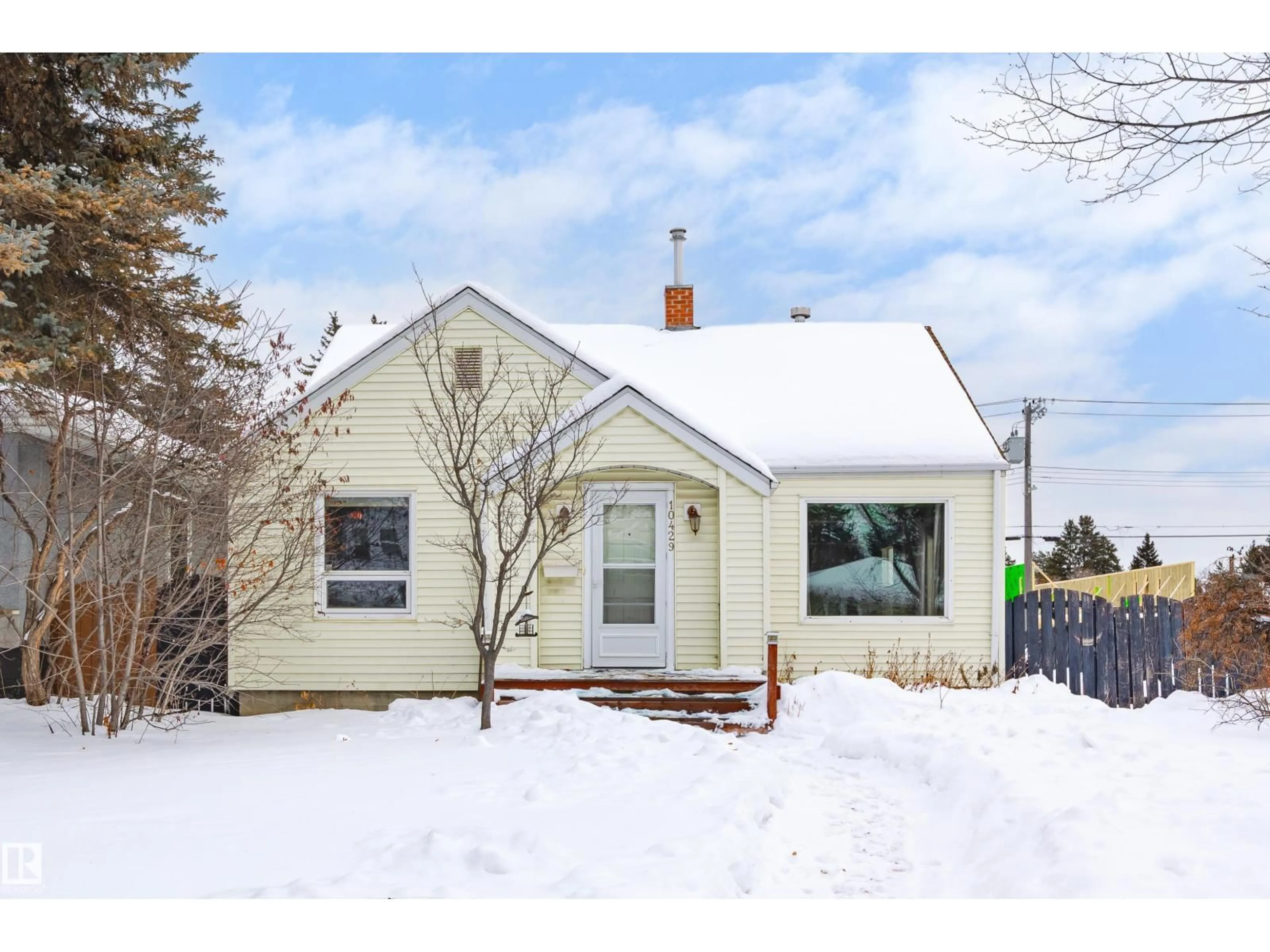 Home with vinyl exterior material, street for 10429 143 ST, Edmonton Alberta T5N2S5