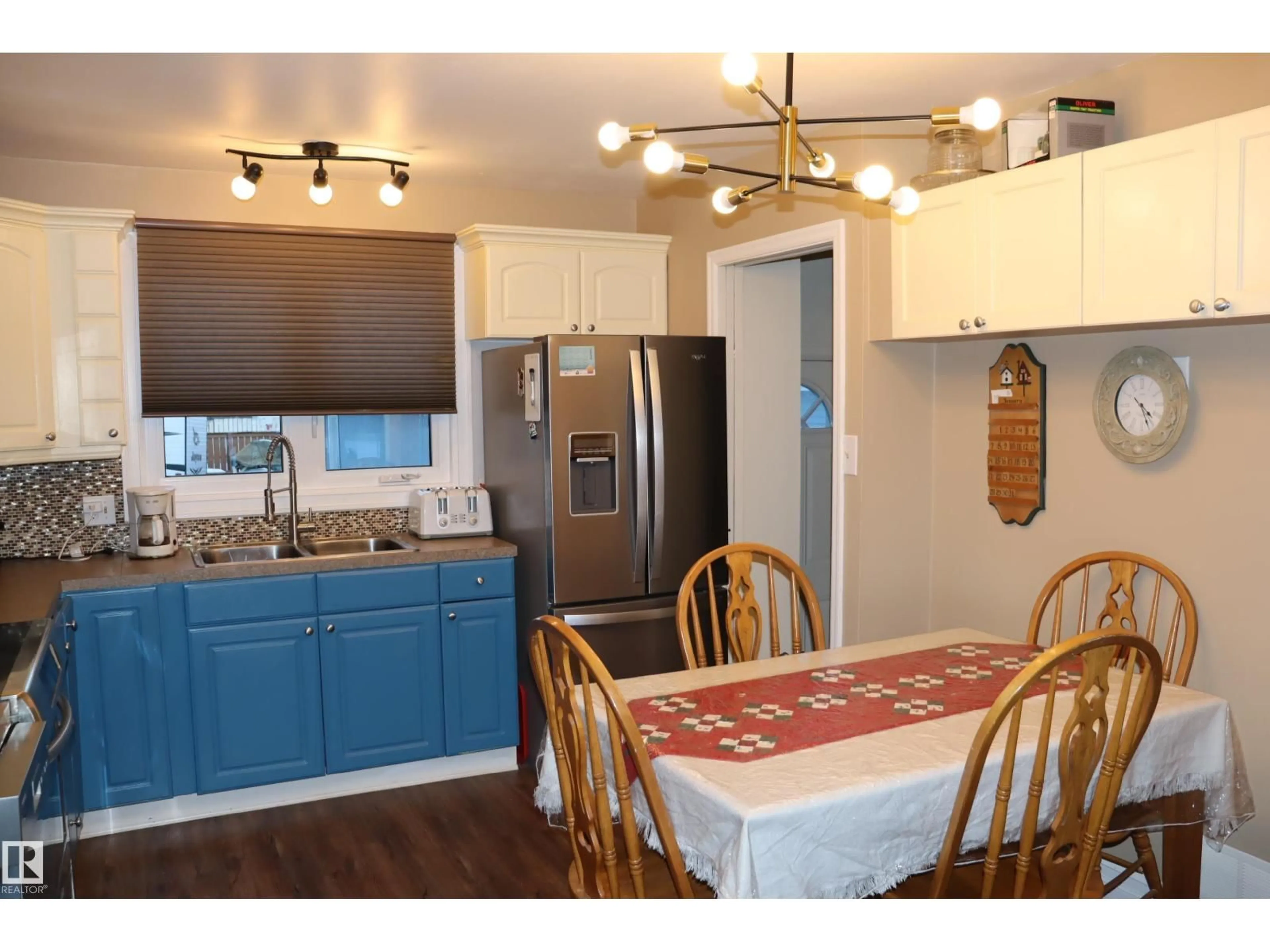 Open concept kitchen, wood/laminate floor for 4023 52 ST, Wetaskiwin Alberta T9A1N1