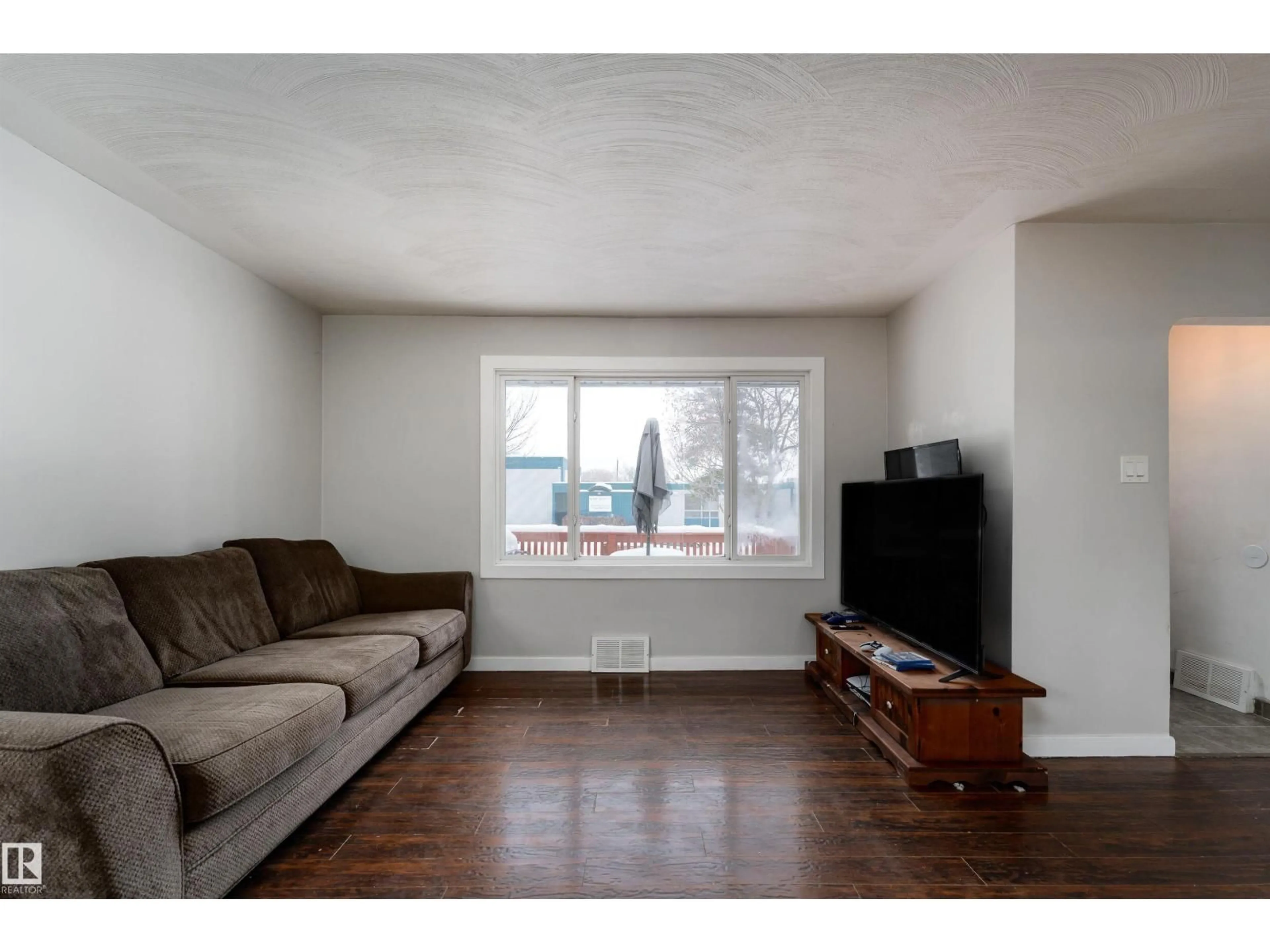 Living room with furniture, wood/laminate floor for NW - 12316 140 ST, Edmonton Alberta T5L2C8