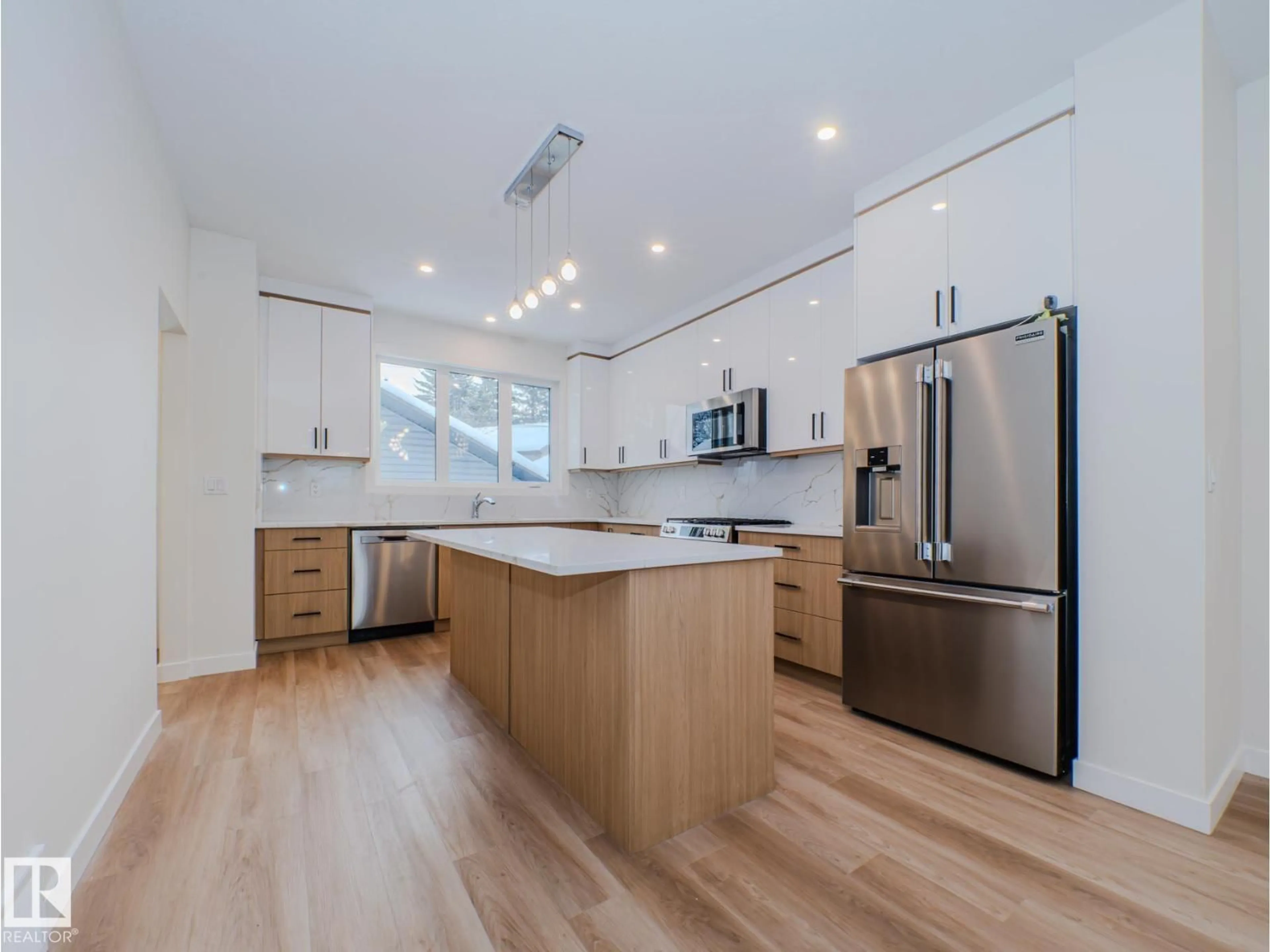 Open concept kitchen, wood/laminate floor for 8713 149 ST, Edmonton Alberta T5R1B5