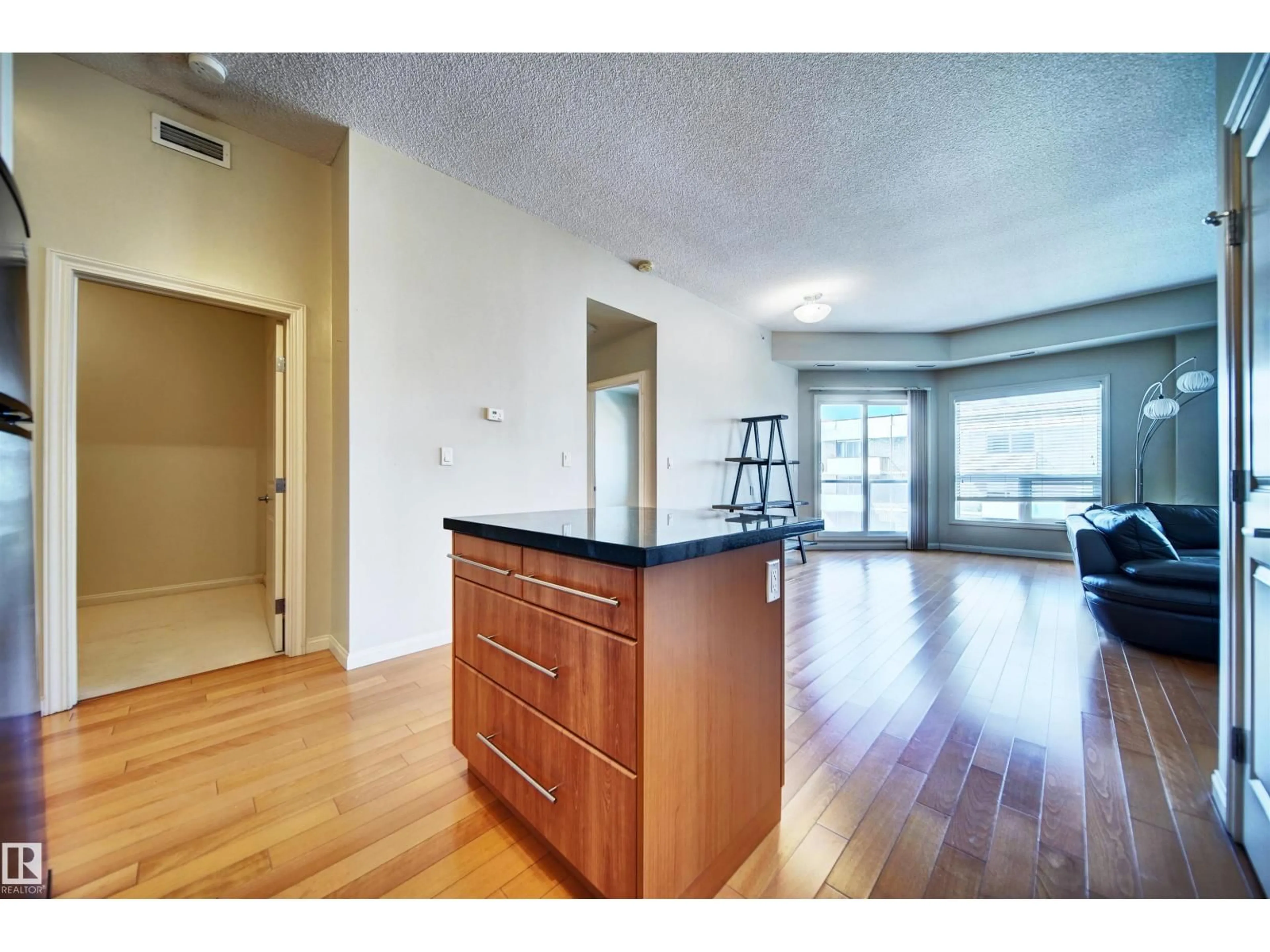 Open concept kitchen, wood/laminate floor for 9819 - 1206 104 ST, Edmonton Alberta T5K0Y8